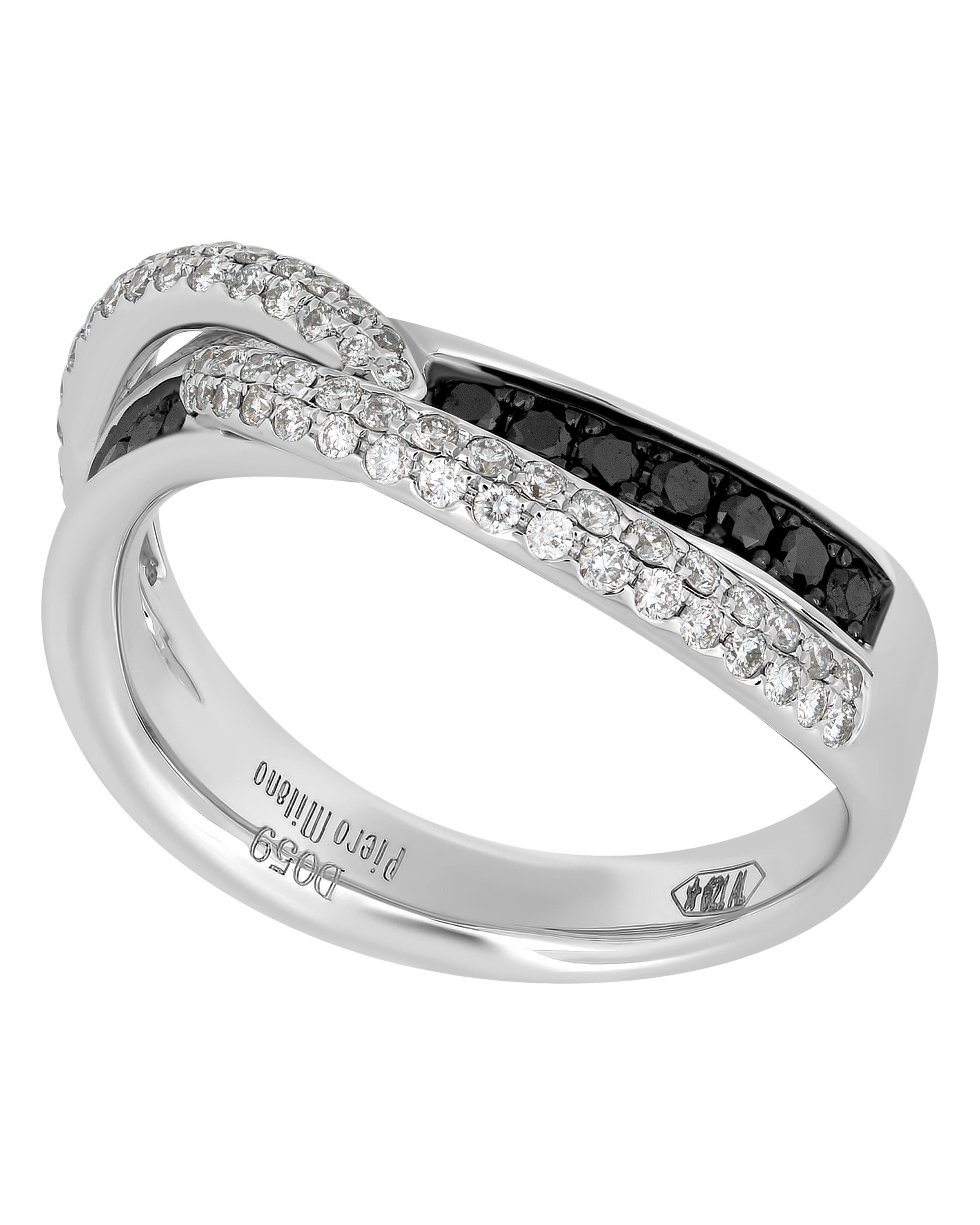 This show-stopping Piero Milano 18K White Gold Crossover Ring features glistening channels of black diamonds (0.24ct twd) elevated with two arches of shimmering white diamonds (0.35ct twd) intertwining at the center. The ring size is 6.75 (53.8).