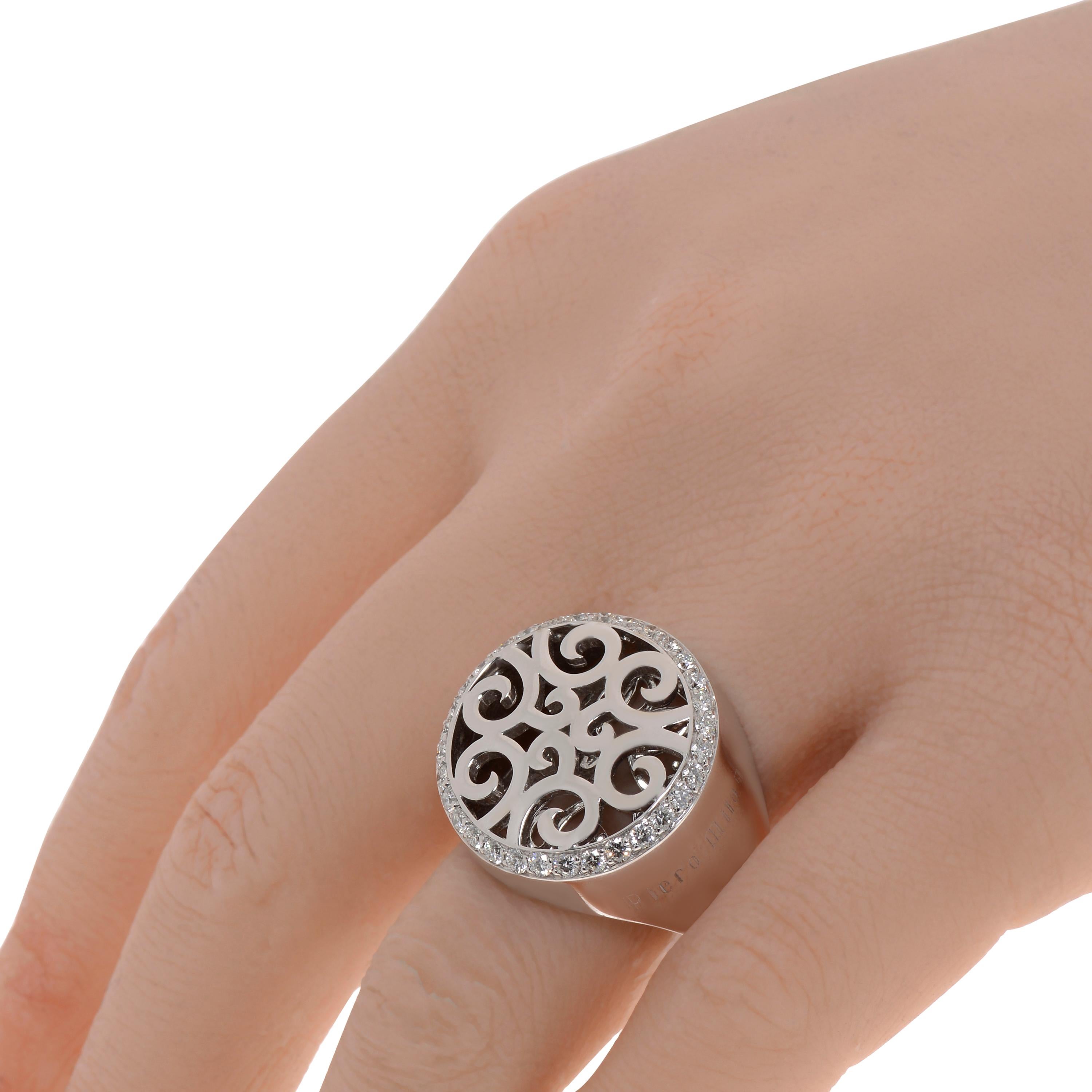 This detailed Piero Milano 18K White Gold Signet Ring features a filagree of white gold framed in a diamond pave 0.84ct twd border. The ring size is 7. The Decoration Size is 22mm. The Weight is 18.2g. Diamond Color: G-H. Diamond Clarity: VS/SI.
