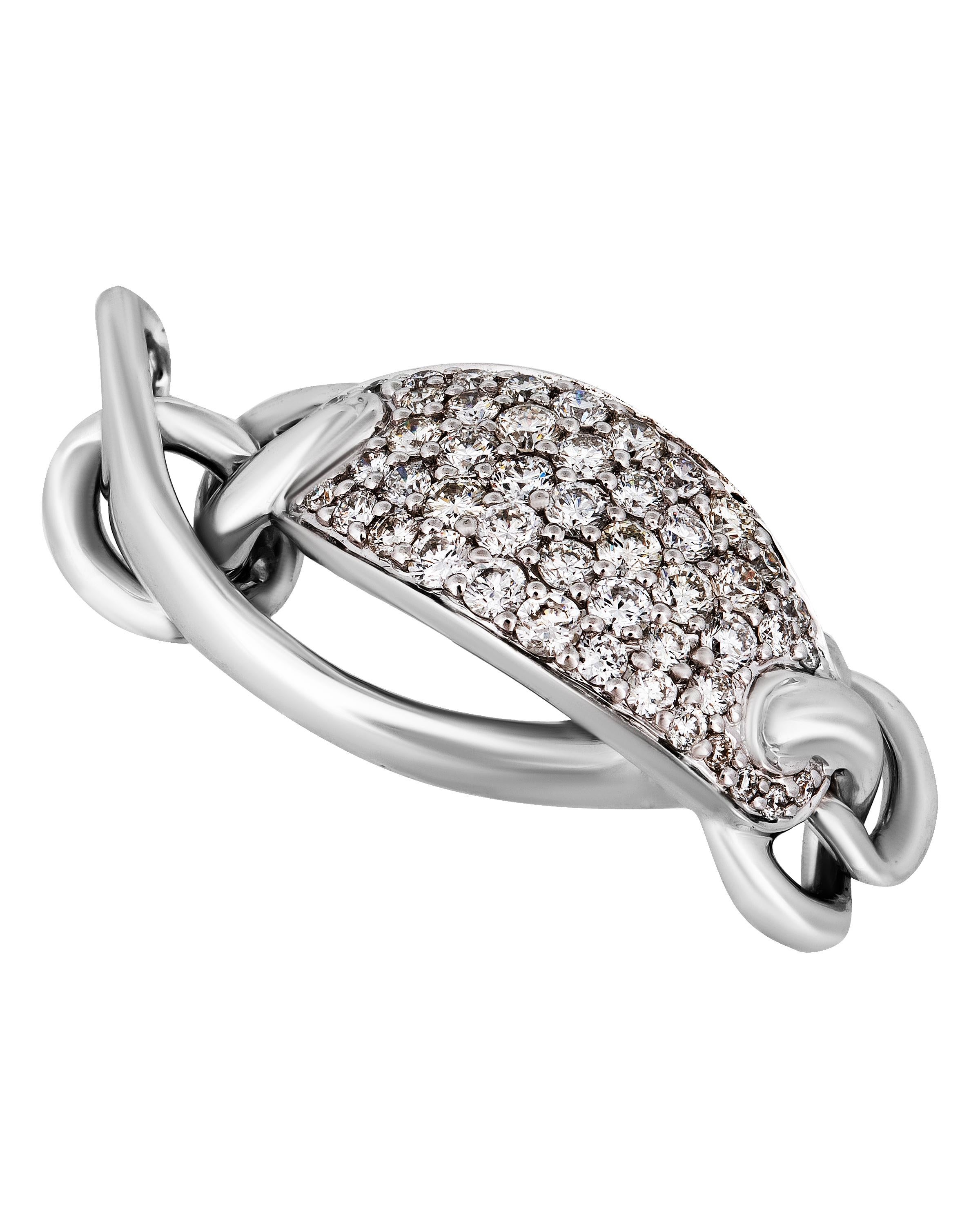 This glittering Piero Milano 18K White Gold Link Ring features a dazzling diamond station 0.69ct. tw. linked to a luscious white gold band. The ring size is 7.25 (55.1). The Decoration Size is 8.9mm. The Weight is 5.3g.
