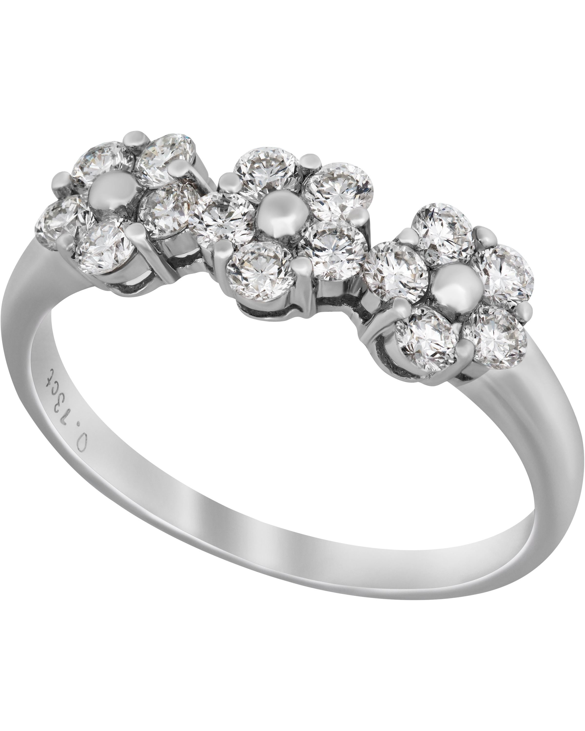 This beautiful Piero Milano 18K White Gold Band Ring features three glistening diamond flowers 0.73ct. tw. adorned with a beaded center of 18K White Gold. The ring size is 7.5 (55.7). The Band Width is 5.9mm. The Weight is 2.8g.
