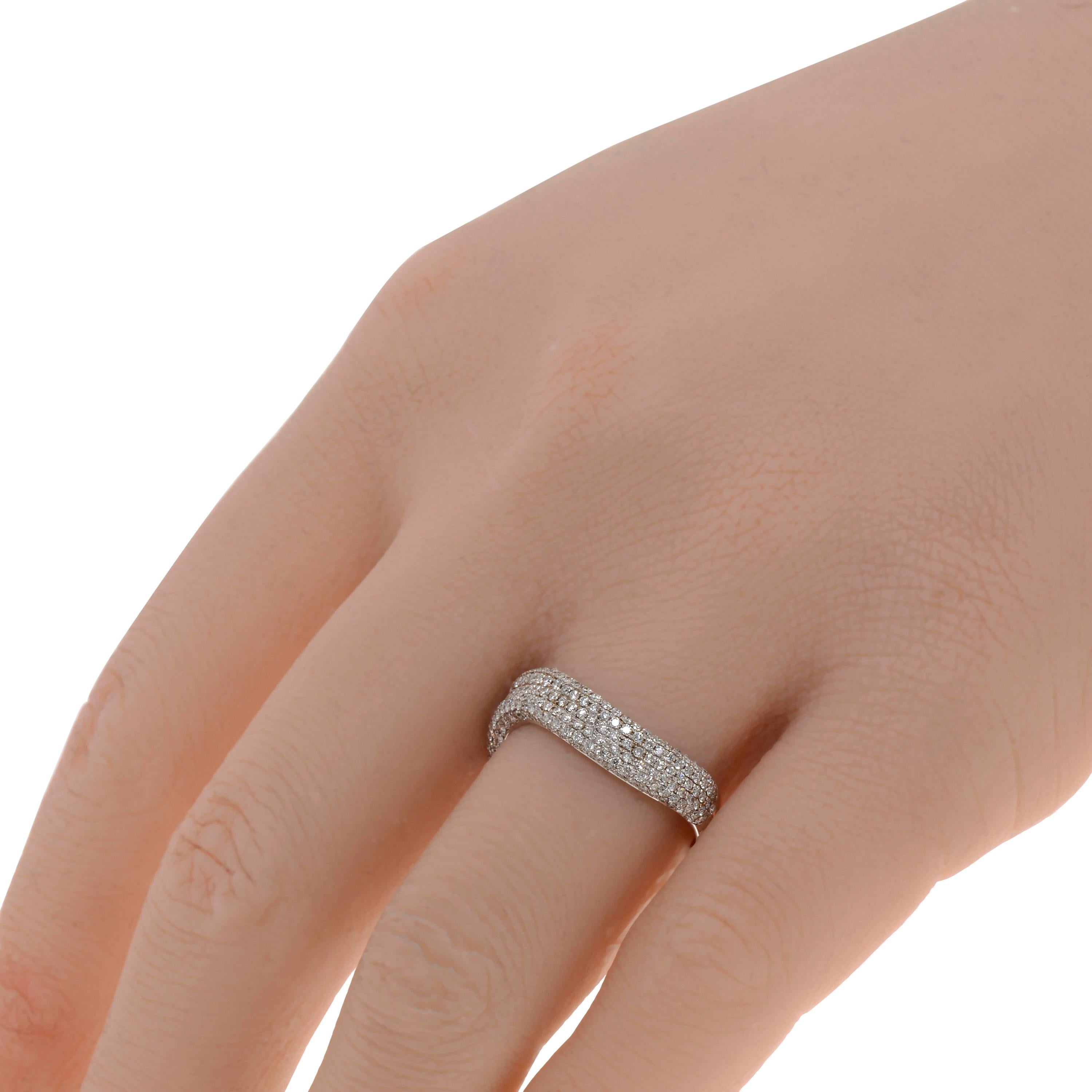 This contemporary Piero Milano 18K White Gold Curved Ring features layers of striking diamonds 0.65ct. tw. lining a curved white gold band. The ring size is 7.5 (55.7). The Band Width is 4.6mm. The Weight is 4.2g.
