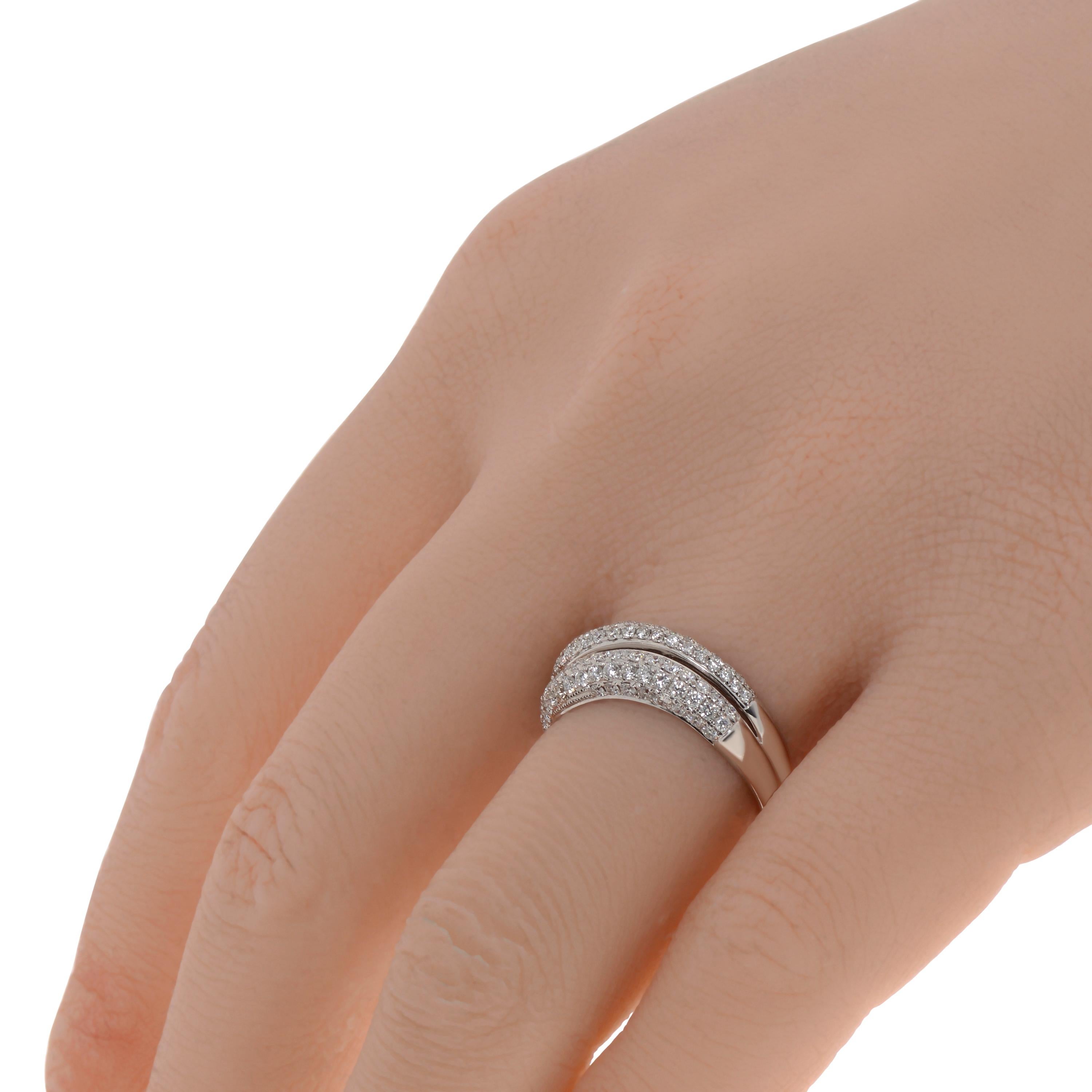This show-stopping Piero Milano 18K White Gold Curved Ring features two layers of striking illusion set diamonds 0.82ct. tw. detailing a curved white gold band. The ring size is 8 (57). The Band Width is 6.1mm. The Weight is 3.8g. Diamond Color: