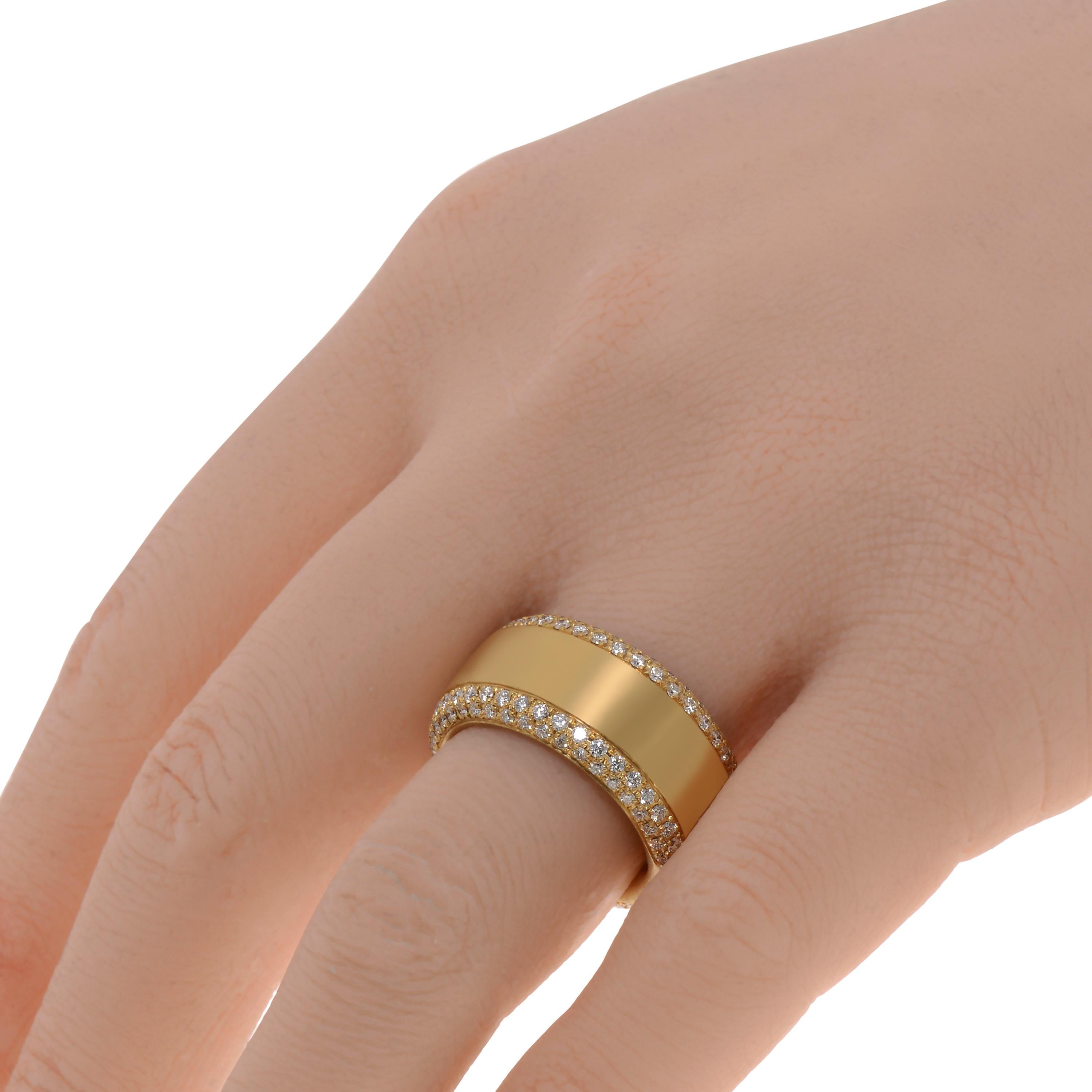 This classic Piero Milano 18K Yellow Gold Band Ring features glittering rows of diamond pave 1.25ct. tw. bordering a brushed Yellow Gold band. The ring size is 7 (54.4). The Band Width is 11.1mm. The Weight is 11.5g. Diamond Color: G-H. Diamond