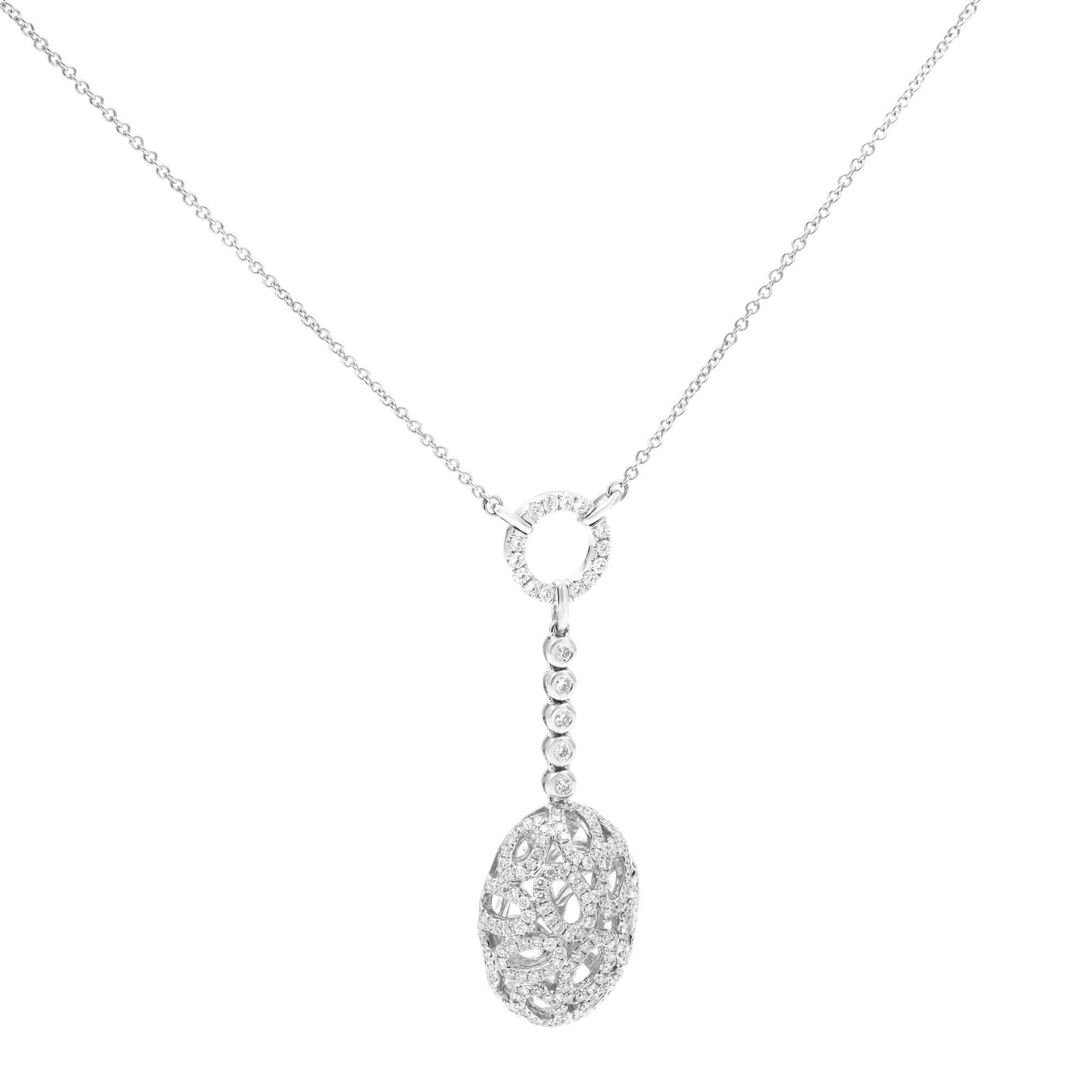 This is an absolutely extraordinary pendant necklace by Piero Milano. This piece features an arabesque 18k white gold oval charm adorned with a small circle diamond bail. Length of the chain is 18 Inches. Total carat weight 1.33 cttw. Diamond color