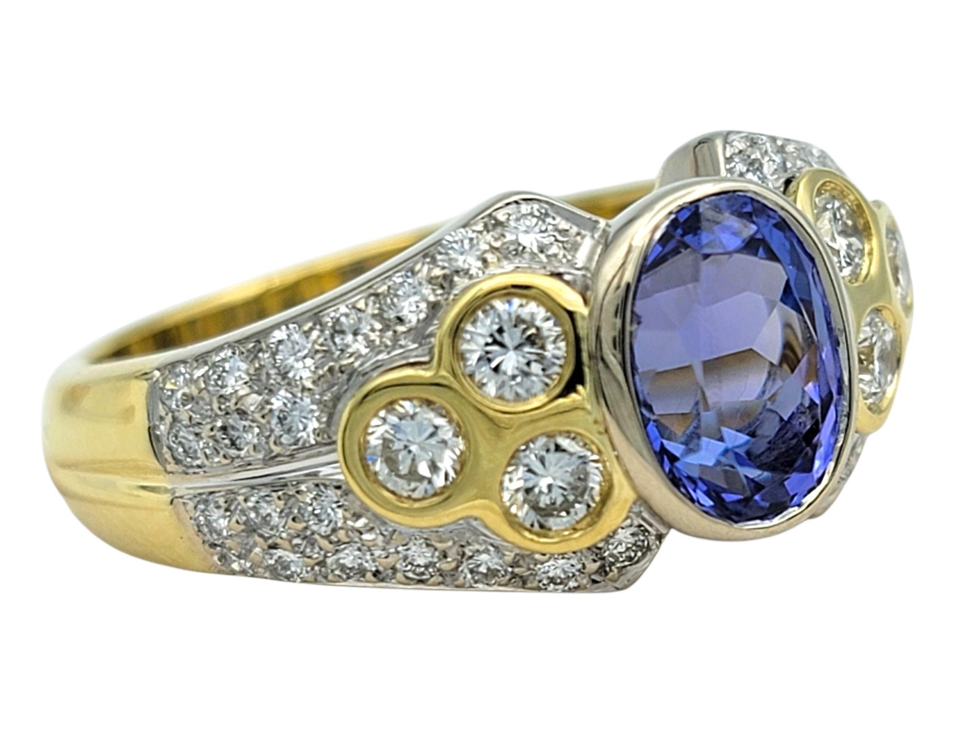 Ring Size: 8

This Piero Milano statement ring is designed to command attention, showcasing a vivid 1.40 carat violet-blue oval tanzanite at its center. The saturated hue of the tanzanite is complemented by an array of round diamonds that frame the