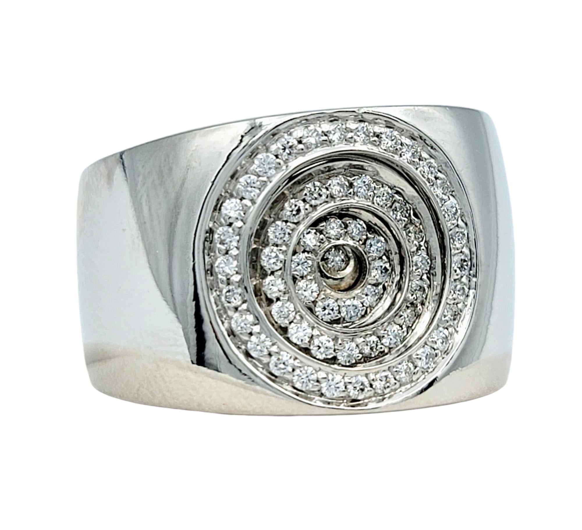 Ring Size: 9.5 

Immerse yourself in the opulence of this Piero Milano pavé diamond circle band ring, a breathtaking piece crafted in luminous 18 karat white gold. This wide-band ring commands attention with its intricate concentric circle design,