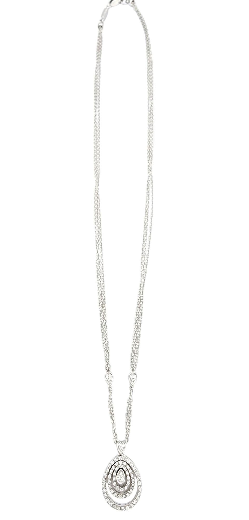 This exquisite Piero Milano triple teardrop halo pendant necklace is a timeless masterpiece crafted in stunning 18-karat white gold. The pendant boasts a mesmerizing design featuring three gracefully layered halos encrusted with brilliant diamonds