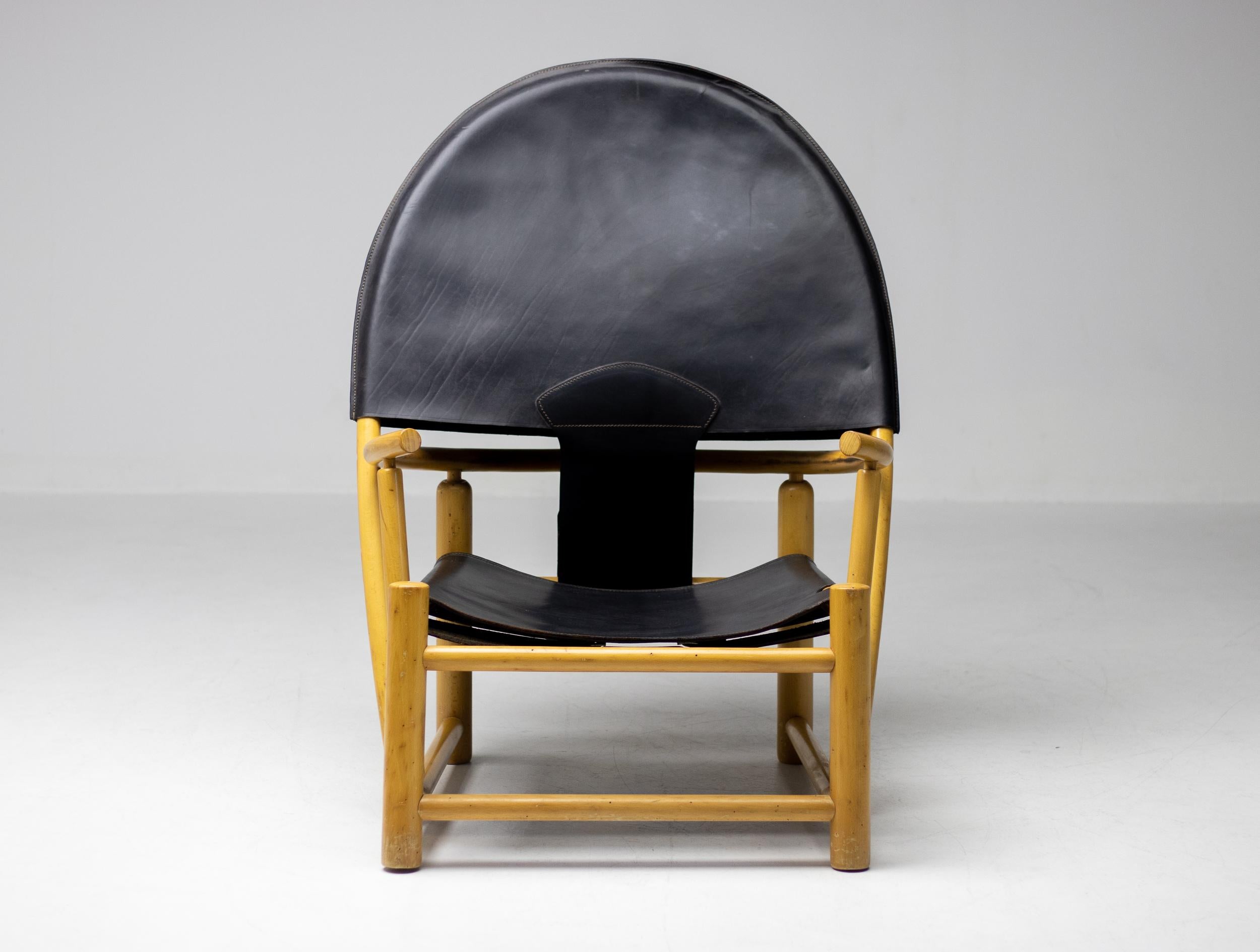 Oversized and huge on character and style this G23 Hoop chair design by Piero Palange and Werther Toffoloni for Germa, Italy is truly a masterpiece. An elegant curvacious solid maple frame combined with beautifully patinated black leather seat. 
The