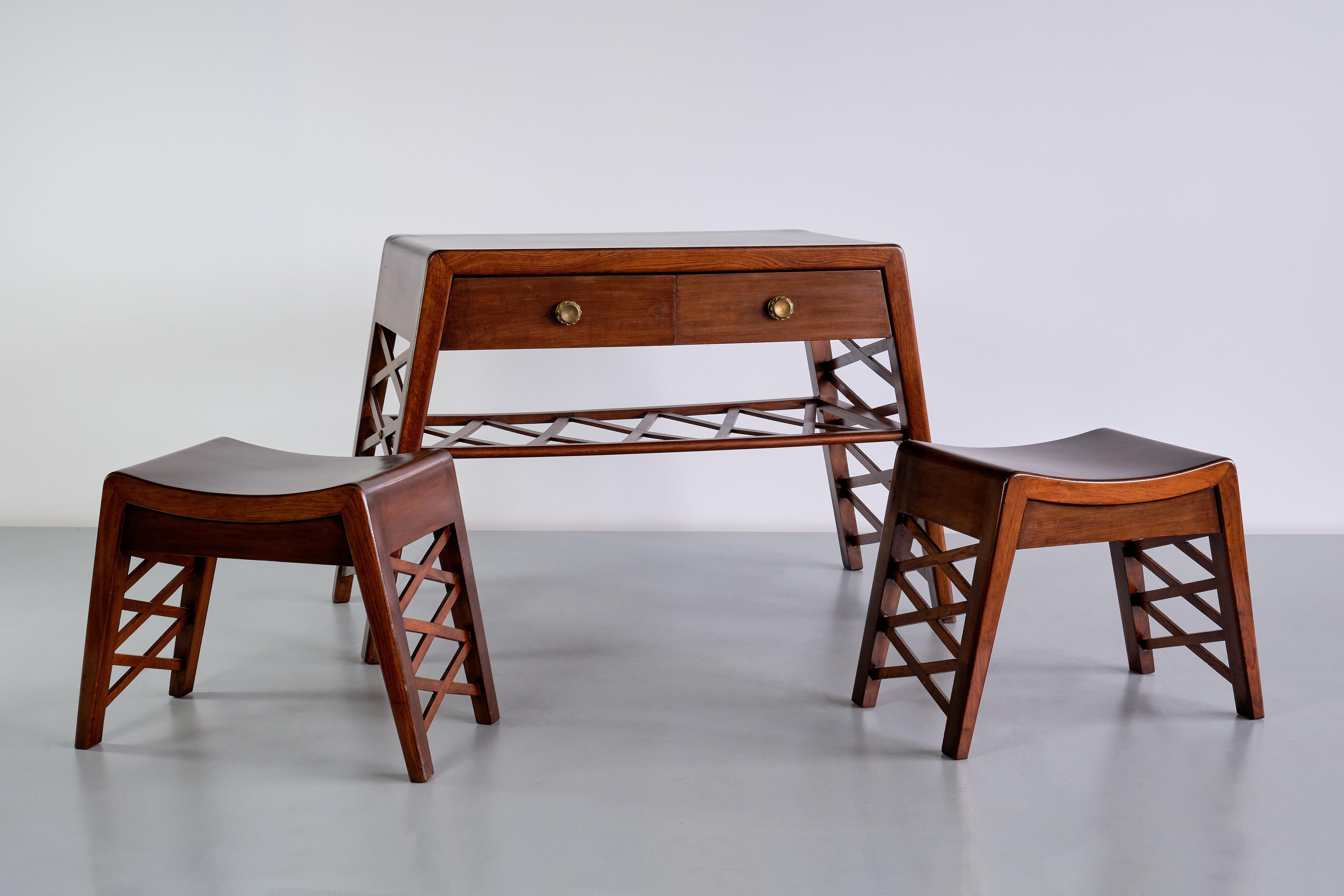 This elegant console was manufactured in Italy in the late 1930s. The console together with the stools (in the second picture) was part of the interior of a private villa in Milan. The design is attributed to Piero Portaluppi. The set was likely