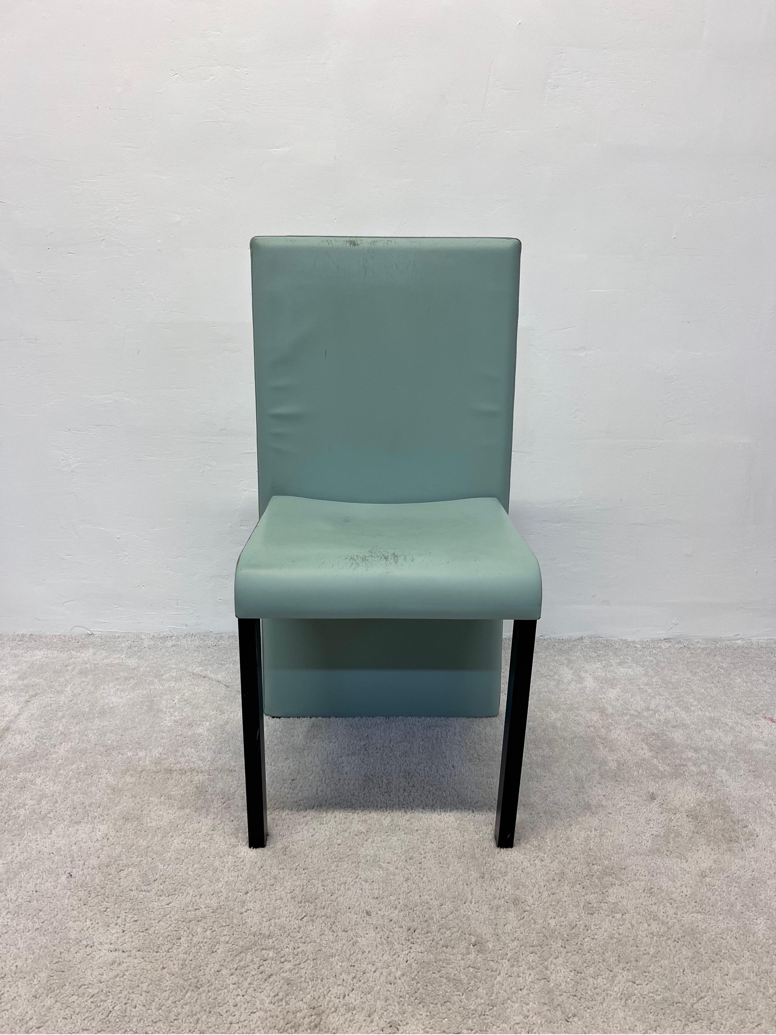 Distressed sea-foam green leather Avio chair designed by Piero Sartogo and Nathalie Grenon for Poltrona Frau, 1998.

The structure of the back of the Avio chair is obtained with harmonic steel bands that guarantee a measured elasticity. The two