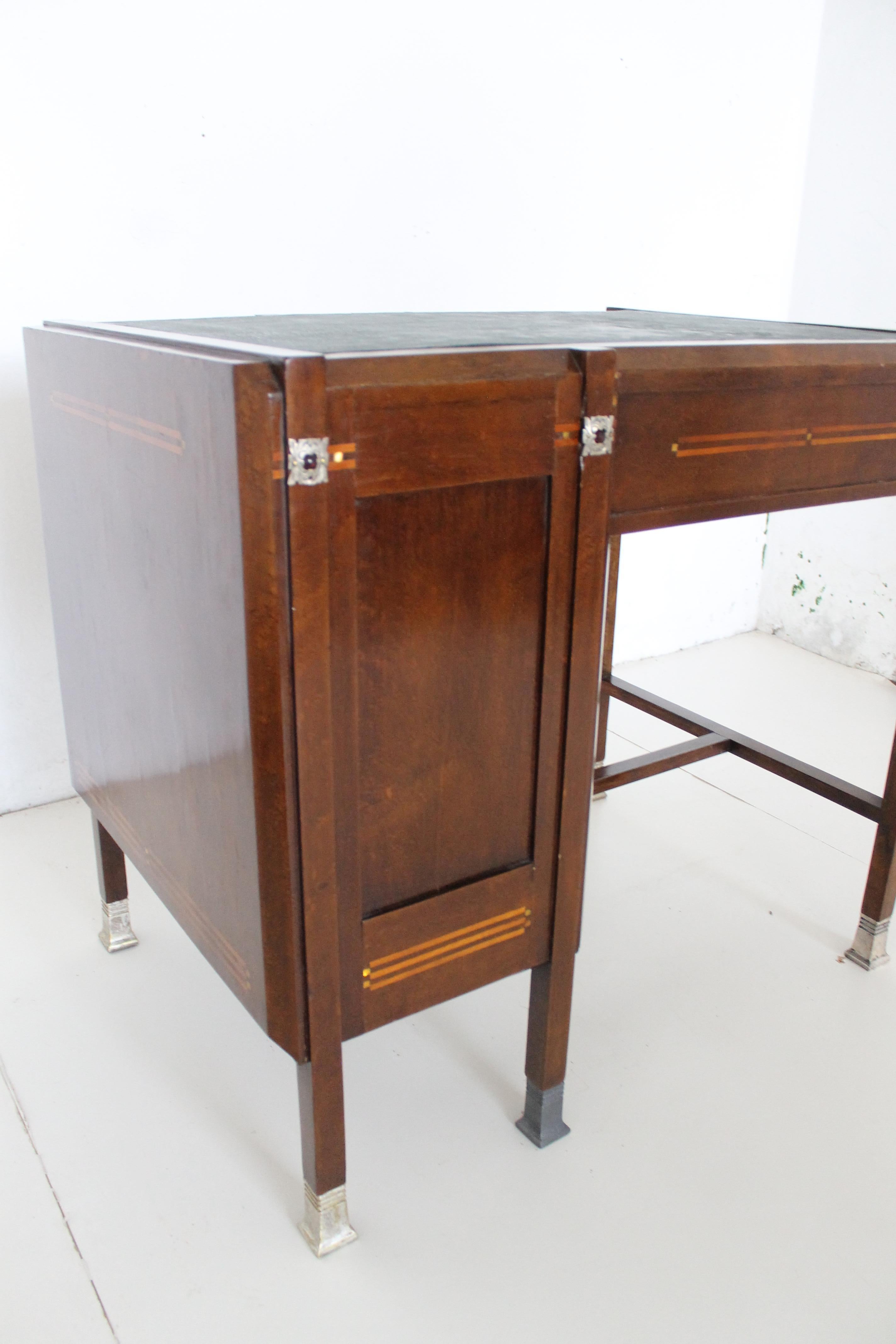 Piero Zen small desk with nickel silver feet and frezies, maple and mather of pearl inlays, circa 1905.
The friezes around the top carry small ruby glass half-spheres.

Signature engreved in the lock of the door (see in the