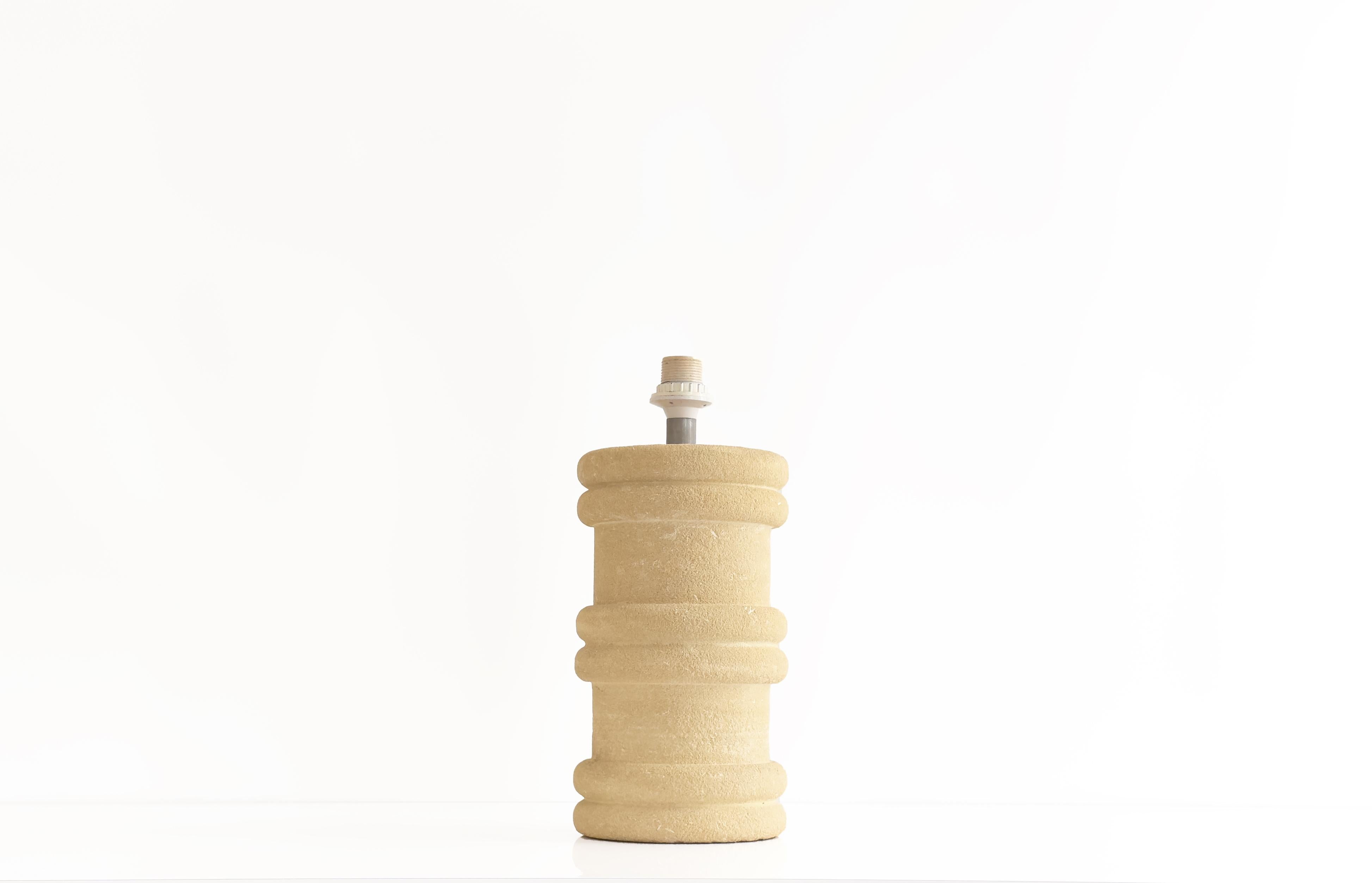 Introducing this exquisite hand-carved stone lamp by renowned French sculptor Pierre Albert Tormos, crafted in the 1970s from the distinctive Pierre du Gard limestone, quarried in France and known for its durability and unique texture. The lamp