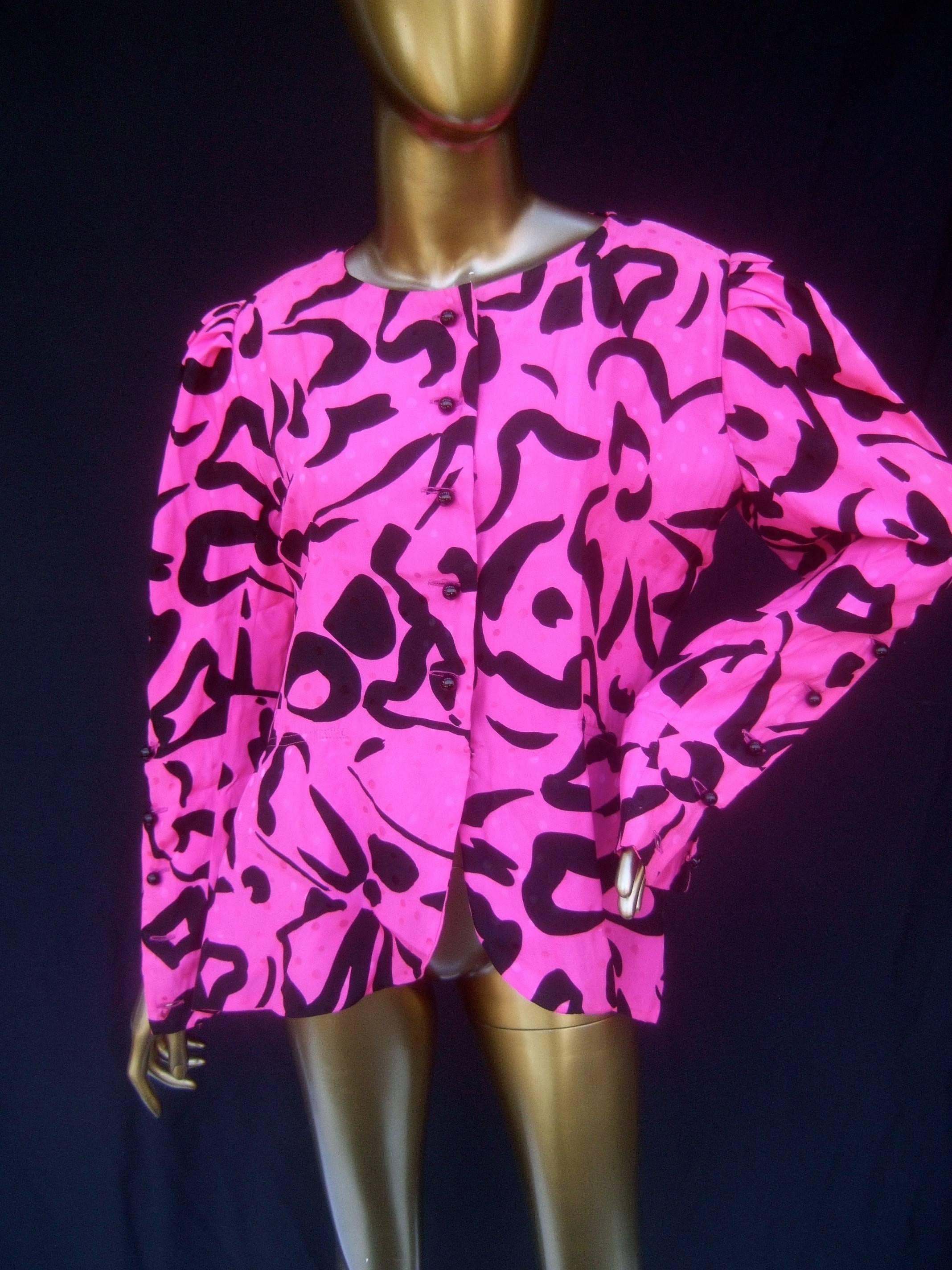 Pierre Balmain Boutique fuchsia silk print blouse Size 42 
The french silk blouse is designed with vibrant 
fuchsia silk with bold black color block graphics 

The fuchsia silk background is designed with very
subtle scattered polkadots throughout.
