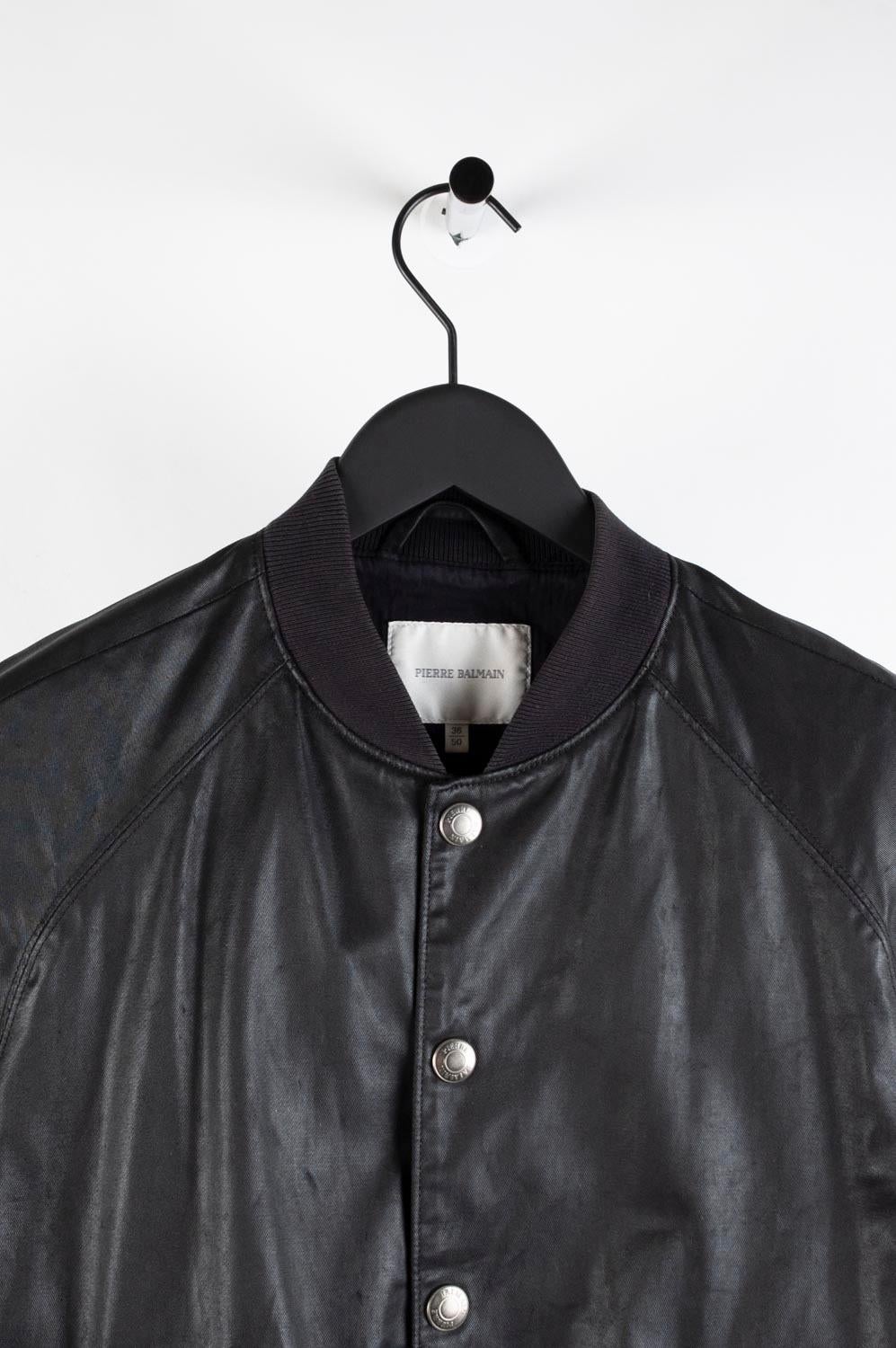 Item for sale is 100% genuine Pierre Balmain Men Bomber Jacket, S318
Color: Black/leather effect
(An actual color may a bit vary due to individual computer screen interpretation)
Material: 95% cotton, 5% polyurethane
Tag size: 50 (M) 
This jacket is