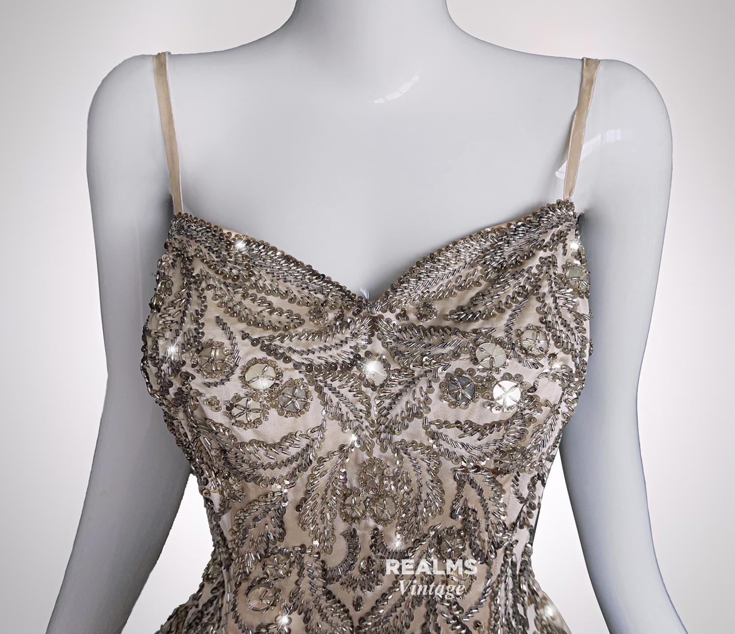 'La Robe Broderie À Ramages'
PIERRE BALMAIN PARIS
Made In France, ca.1955

Majestic evening gown in silk and cream satin with the most astonishing embroiderery by PIERRE BALMAIN Haute Couture workshop bolduc, numbered 33, named handwritten and