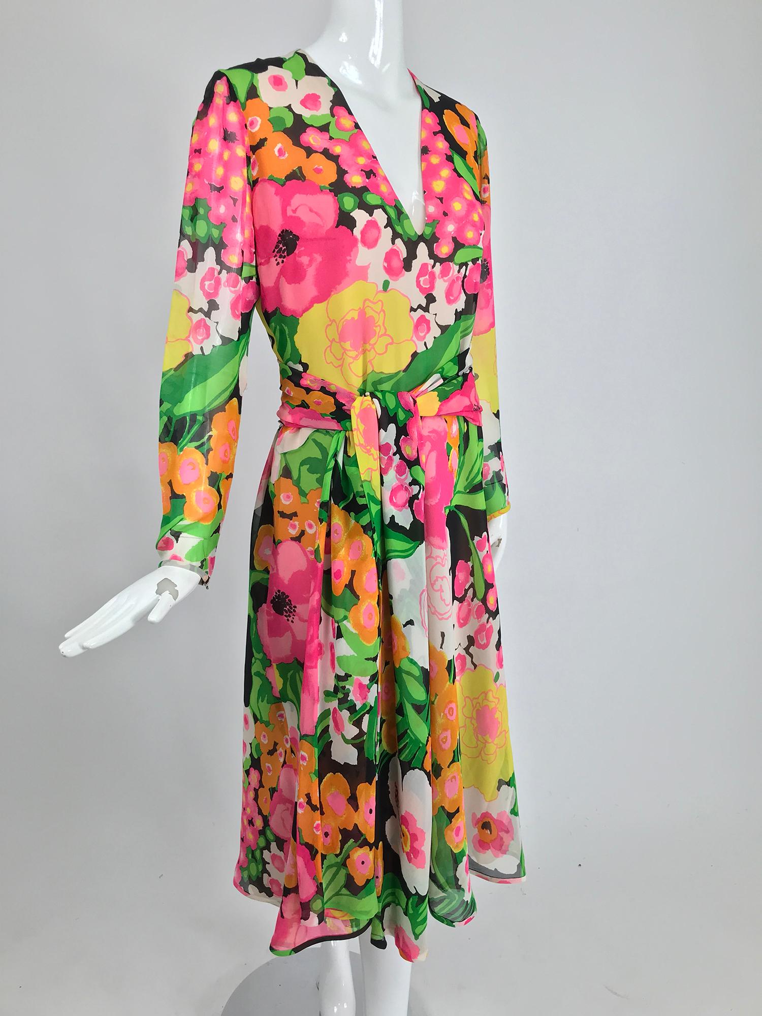 Pierre Balmain Haute Couture pieced silk chiffon vibrant floral dress and sash. Silk chiffon fabric has been intricately worked into a piece of art. The bodice and sleeves are cut from the whole fabric, the skirt is composed of hand cut and turned