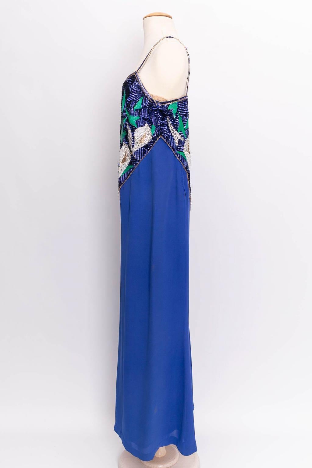 Pierre Balmain Haute Couture - Evening dress in viscose embroidered with pearly beads. No composition or size tag, it fits a size 36FR/38FR.

Additional information: 

Dimensions: 
Bust: 47 cm (18.5