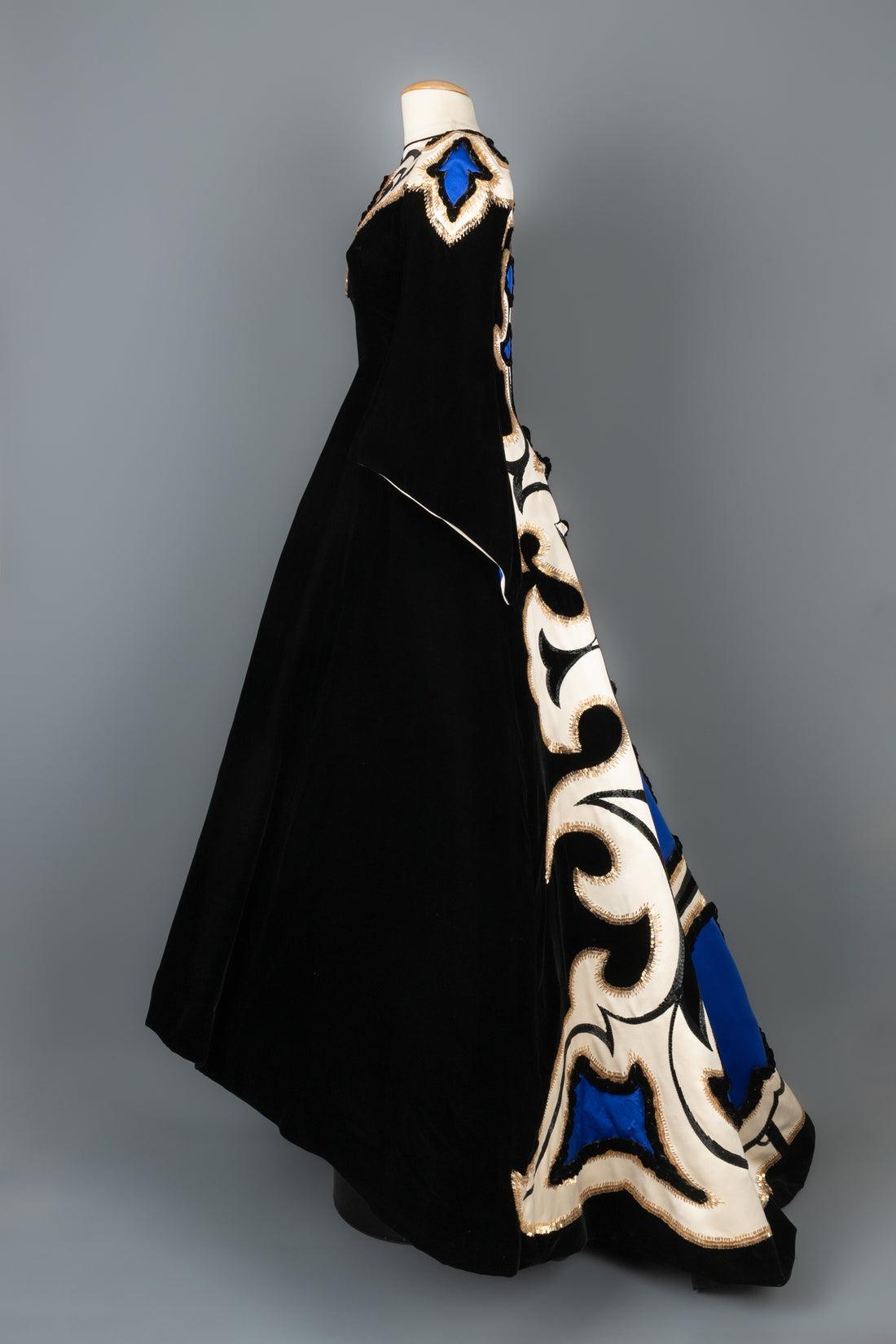 Balmain - (Made in France) Haute Couture maxi evening dress with a black velvet train aplicated with cream and blue satin. It is embroidered with black and golden tube pearls and velvet. The slipdress with boning has multiple tulle flounces. No size