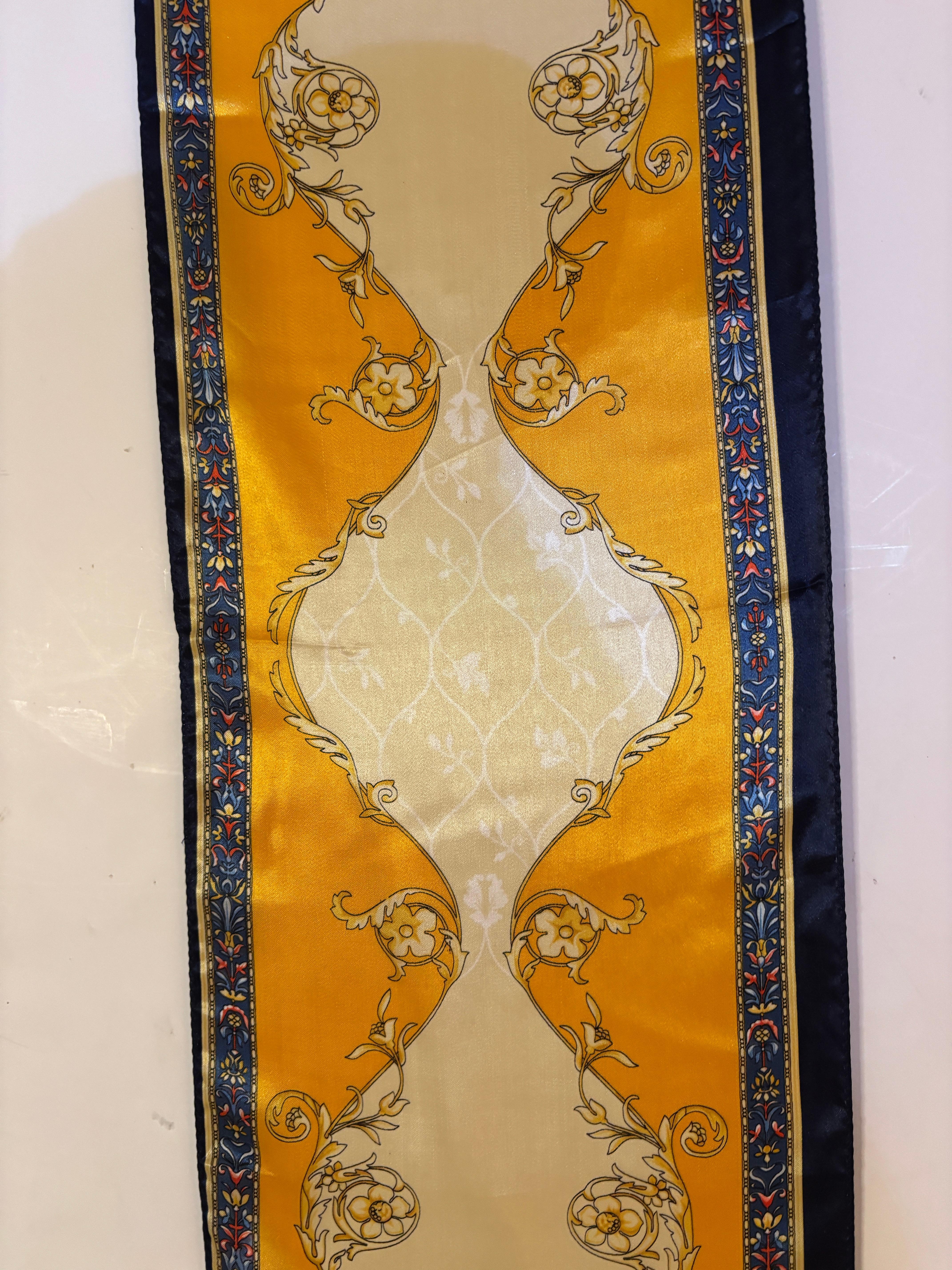 Pierre Balmain Paris, Francois 1er design neckerchief scarf.
Beautiful Balmain Paris France gold and blue motif, very elegant.
France.
Polyester.
Dimensions: 12 inches x 39.5 inches.