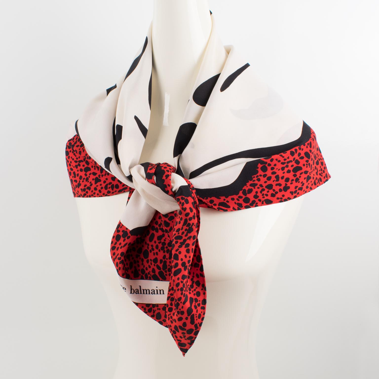 Stylish silk scarf by Pierre Balmain Paris. With a 1970s typical print, this vintage silk scarf features an oversized rose flower in an assorted combination of red and black on an ivory-white background. Signed Pierre Balmain Paris in the bottom