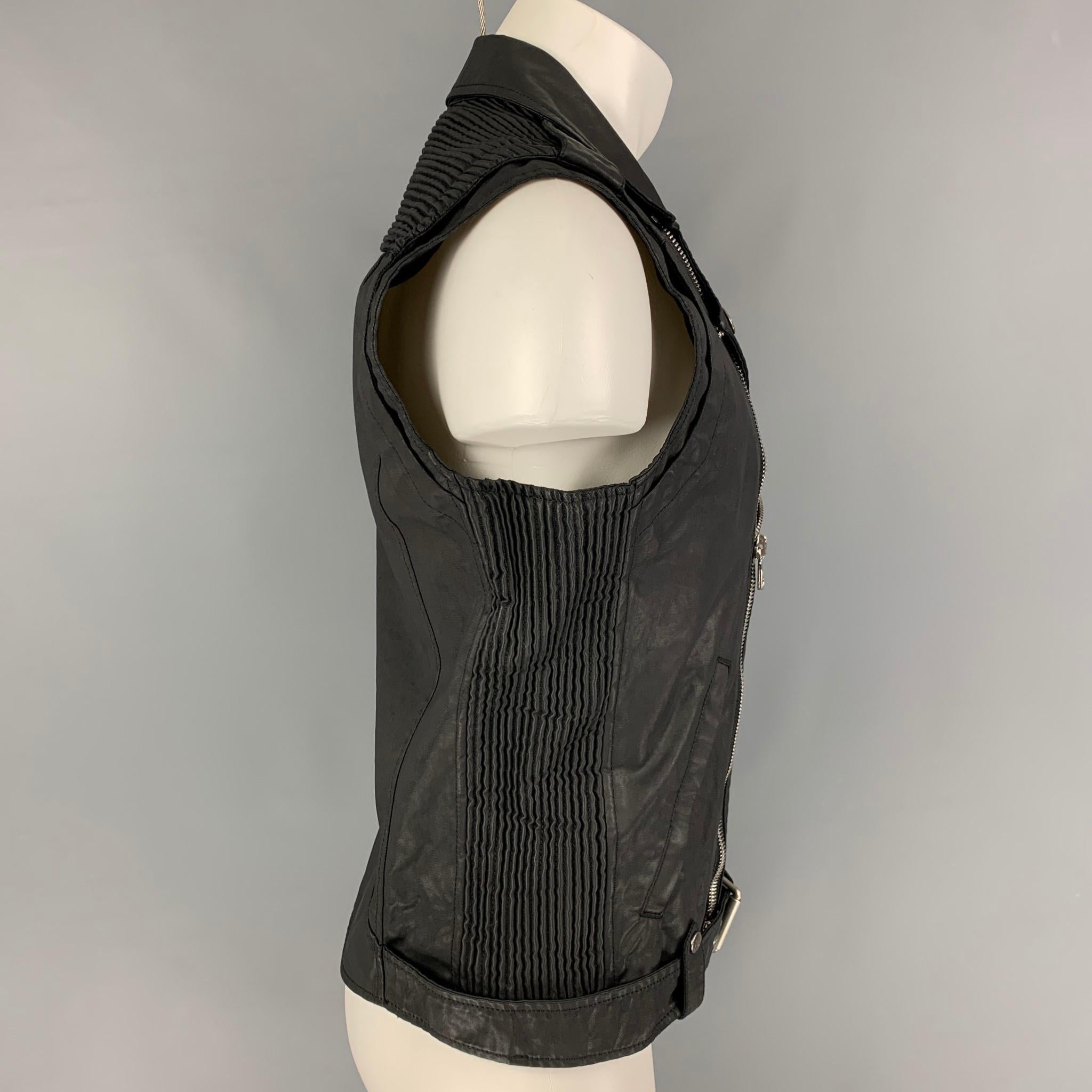 PIERRE BALMAIN vest comes in a black coated cotton / polyurethane featuring a biker style, ribbed panels, silver tone hardware, belt detail, zipper pockets, and a zip up closure. Made in Italy.

New With Tags. 
Marked:
