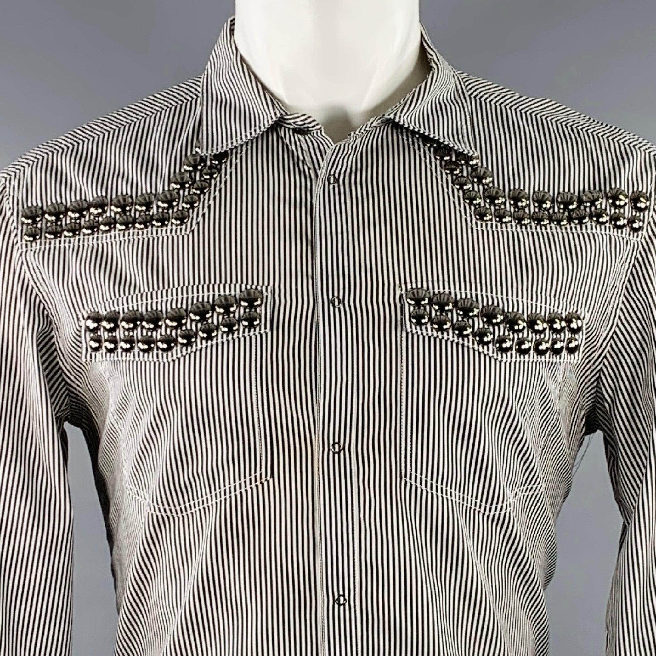 PIERRE BALMAIN long sleeve shirt in a black & white stripe cotton featuring studded details, spread collar, and a snap button closure. Made in Italy.Very Good Pre-Owned Condition. Minor mark on front that is well hidden by pattern. 

Marked:   36/50