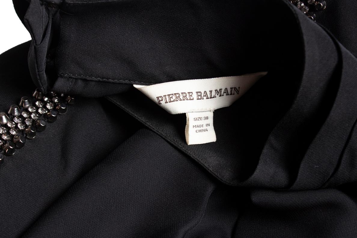 De las mujeres Pierre Balmain, top con hombreras en venta