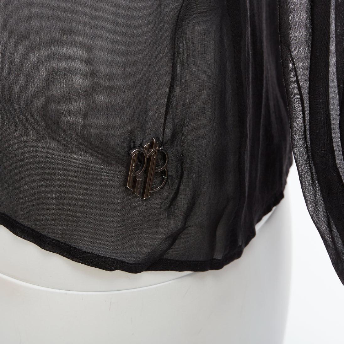 PIERRE BALMAIN Vintage black sheer silk balloon sleeve blouse Sz.24 FR38 S
Reference: YIKK/A00139
Brand: Pierre Balmain
Material: Feels like silk
Color: Black
Pattern: Solid
Closure: Button
Extra Details: PB metal logo at left
