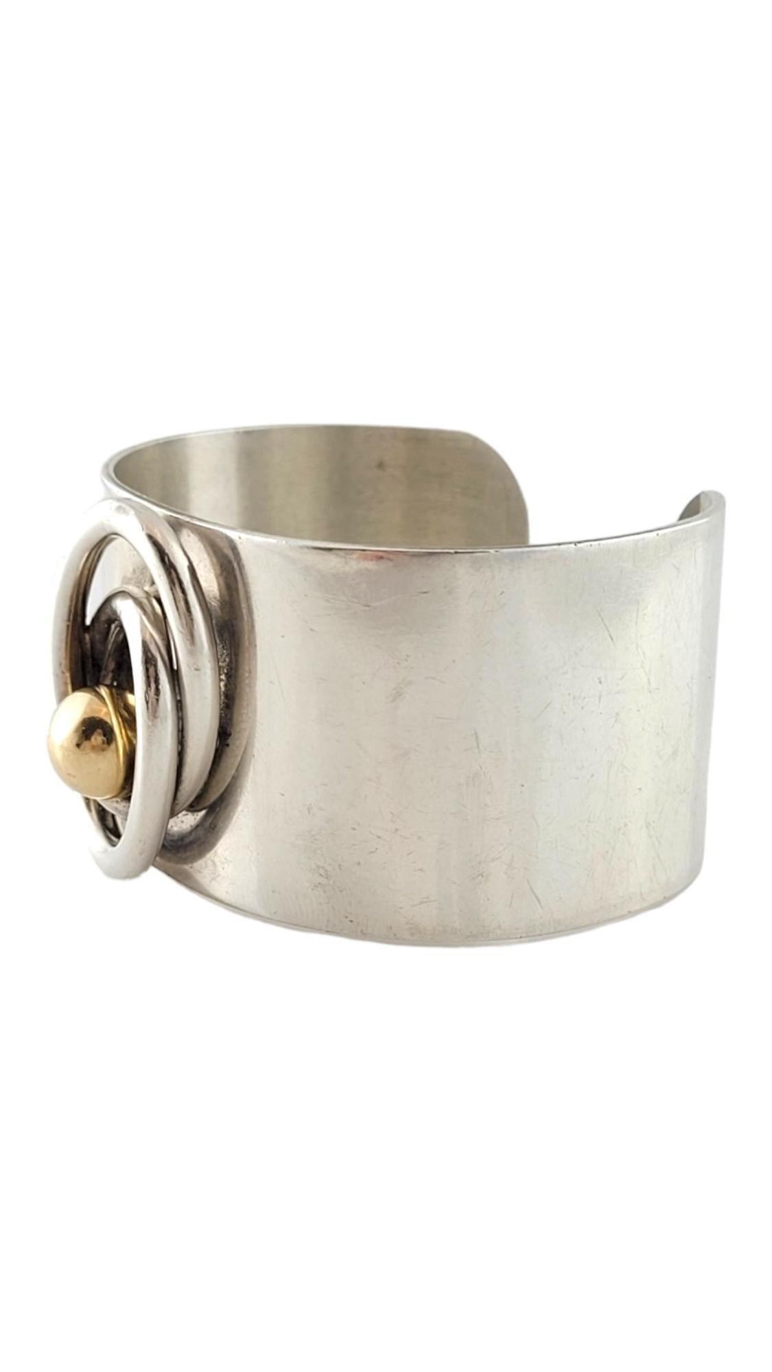Vintage Pierre Cardin 14K Yellow Gold & Sterling Silver Modernist Cuff Bracelet

This gorgeous modernist cuff bracelet by Pierre Cardin is crafted from sterling silver with beautiful 14K yellow gold detailing!

Size: 5 3/4