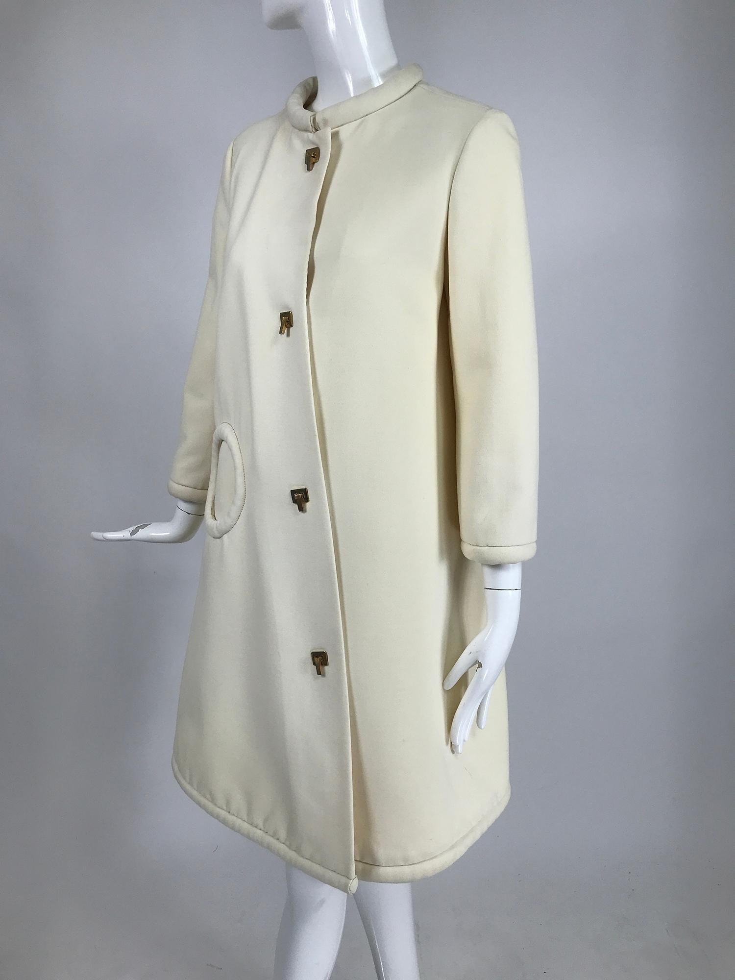 Pierre Cardin 1960s Off White Wool Coat with Metal Toggle Clasps Circle Pocket In Good Condition For Sale In West Palm Beach, FL