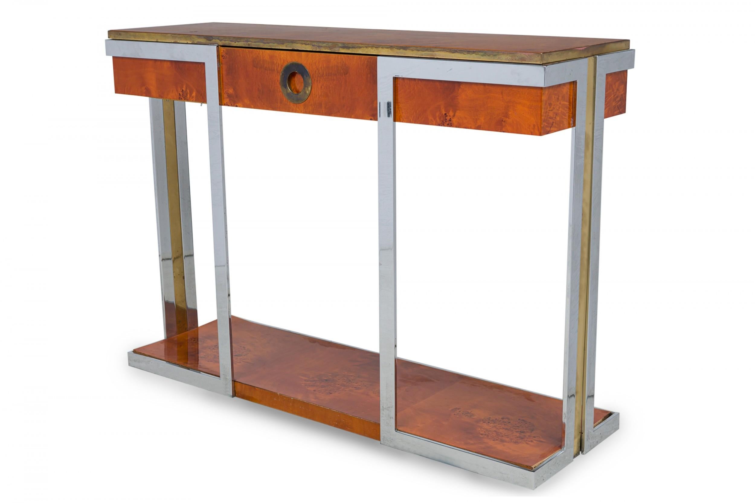 Midcentury American Modern burled walnut, chrome and brass console table in rectangular form features a veneered burl top bordered by a brass band, center drawer with recessed brass circular pull, 4-legged chromed steel frame inlaid with additional