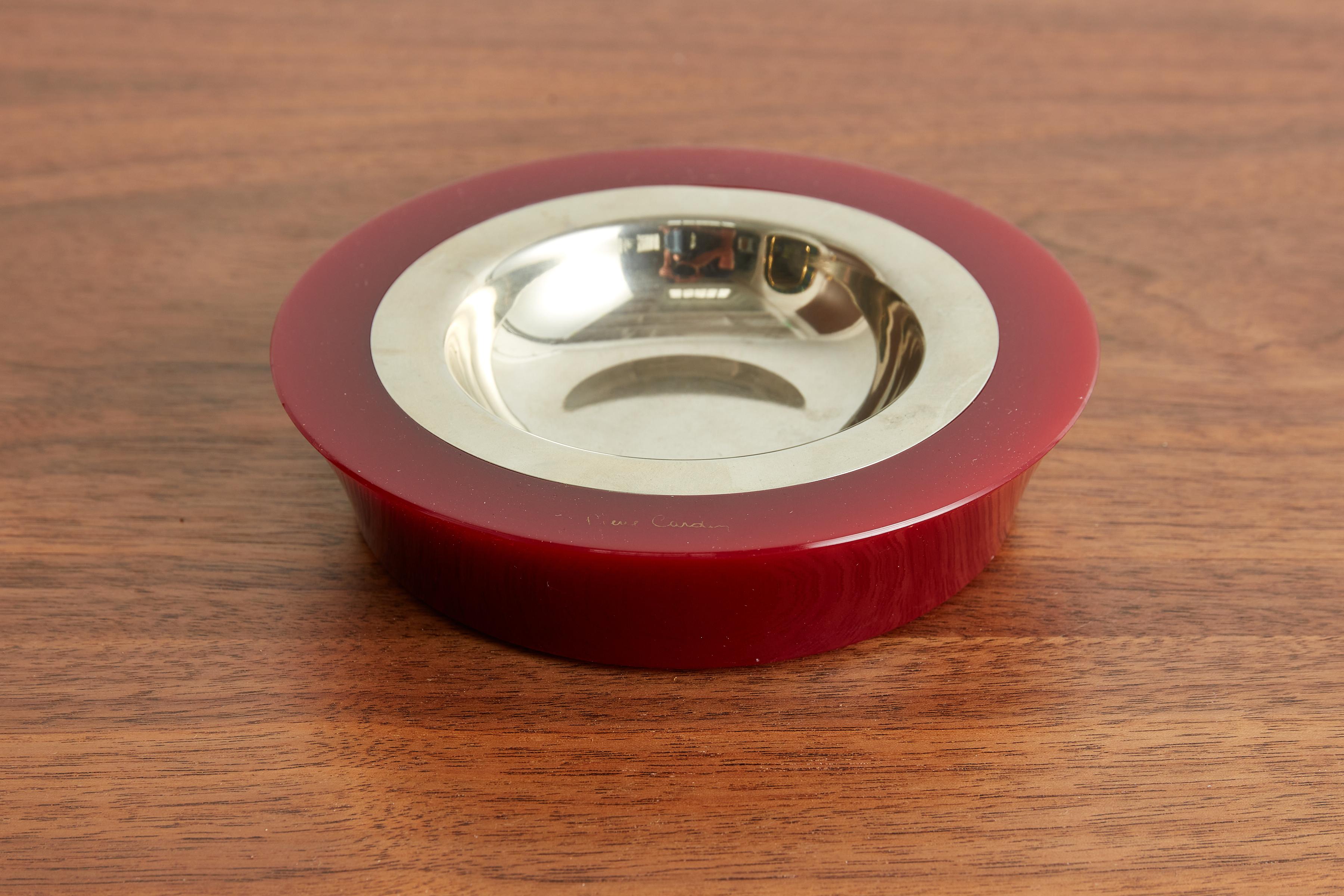 Pierre Cardin ashtray in cherry red lucite with removable brass insert.
Signed.