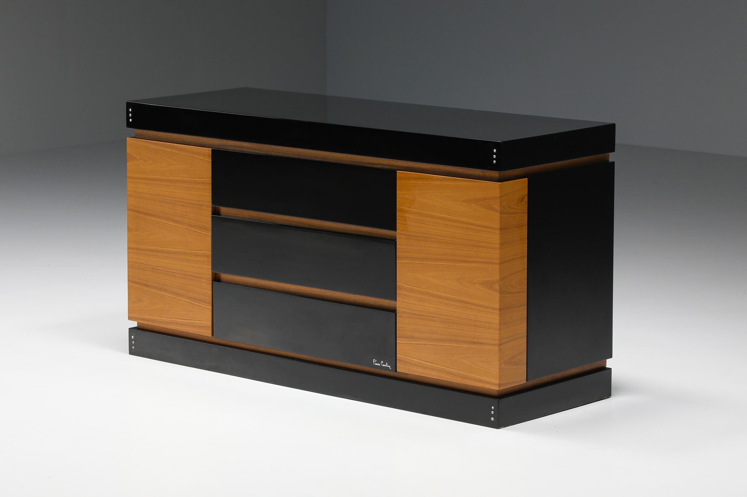 Pierre Cardin; French Design; Black lacquer; Teak drawer; Cabinet; Credenza;

Pierre Cardin sideboard in black lacquered wood and teak. This item is provided with two doors on each side and three large center drawers to provide maximum storage
