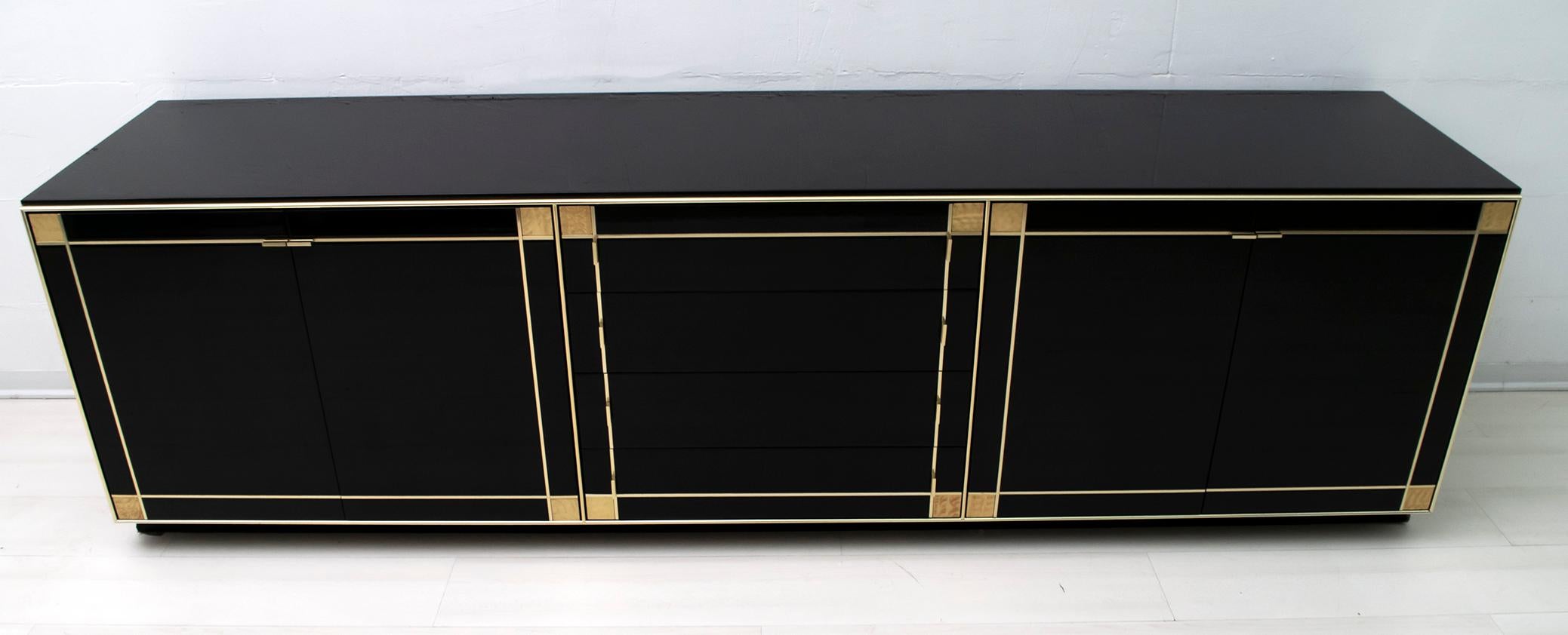 Hollywood Regency sideboard in the style of Maison Jansen, designed by the French designer Pierre Cardin in the 1980s.

This large sideboard with four cabinets and four large drawers offers plenty of space. The front of the wardrobe is finished