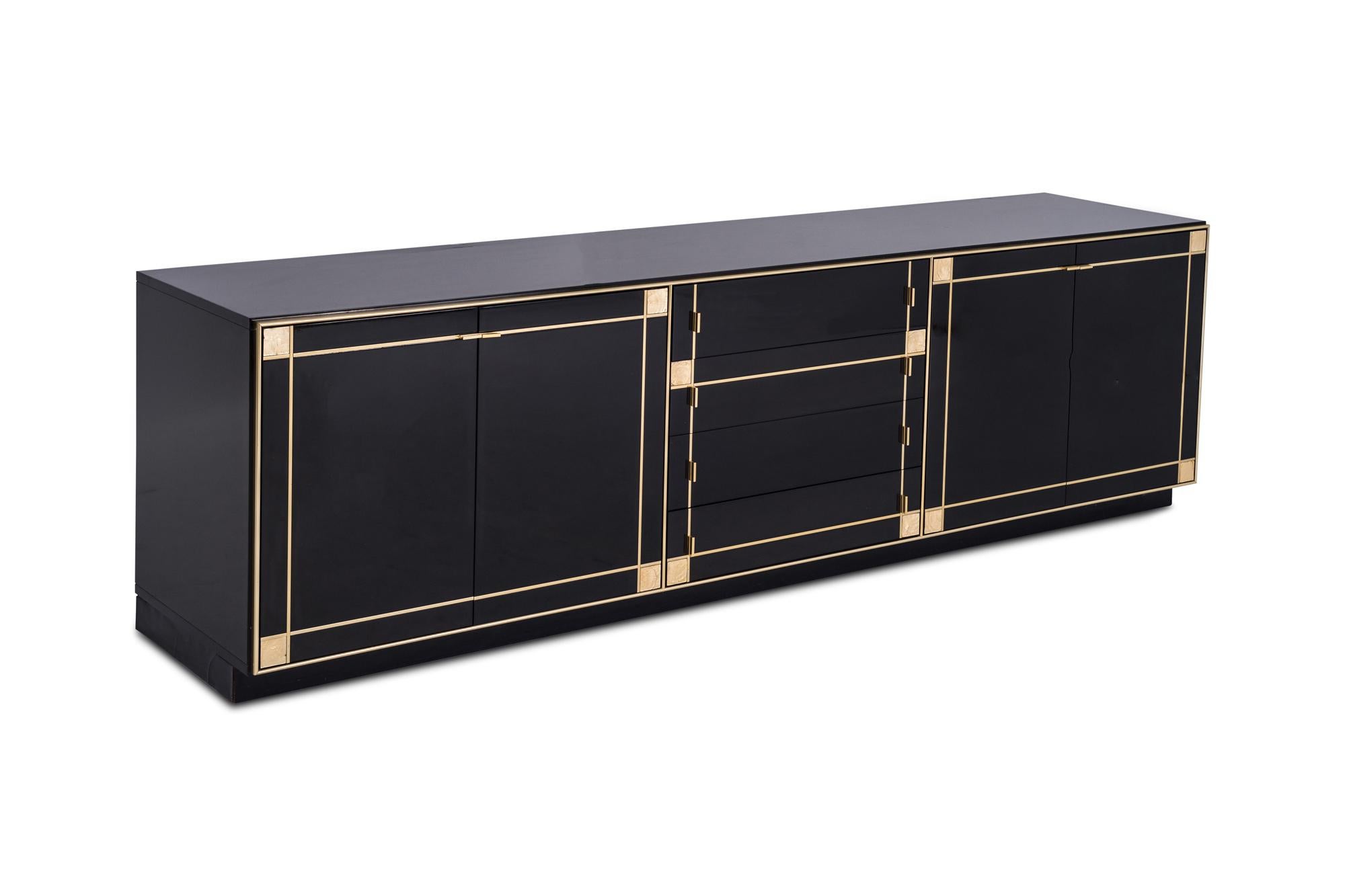 Hollywood Regency credenza in the style of Maison Jansen, designed by French designer Pierre Cardin in the 1980s. 

This large credenza with four cabinets and four large drawers provides plenty of storage space. The front of the cabinet is
