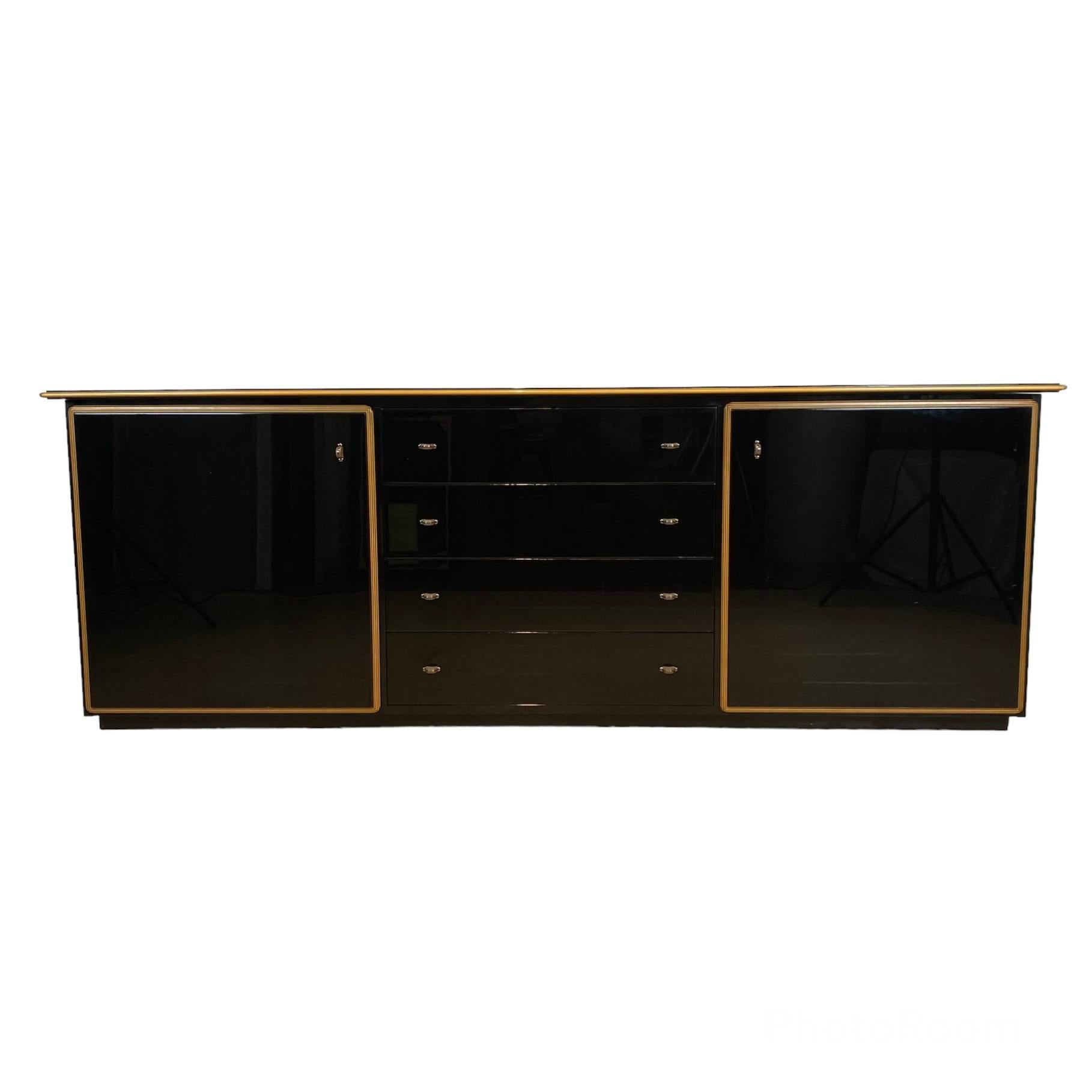 Pierre Cardin black lacquered sideboard with shaped wood. France, late 70s.
 
Rare black lacquered sideboard designed by the Master fashion designer Pierre Cardin in France in the late 70s. 
 
This sideboard has two side doors and central chest