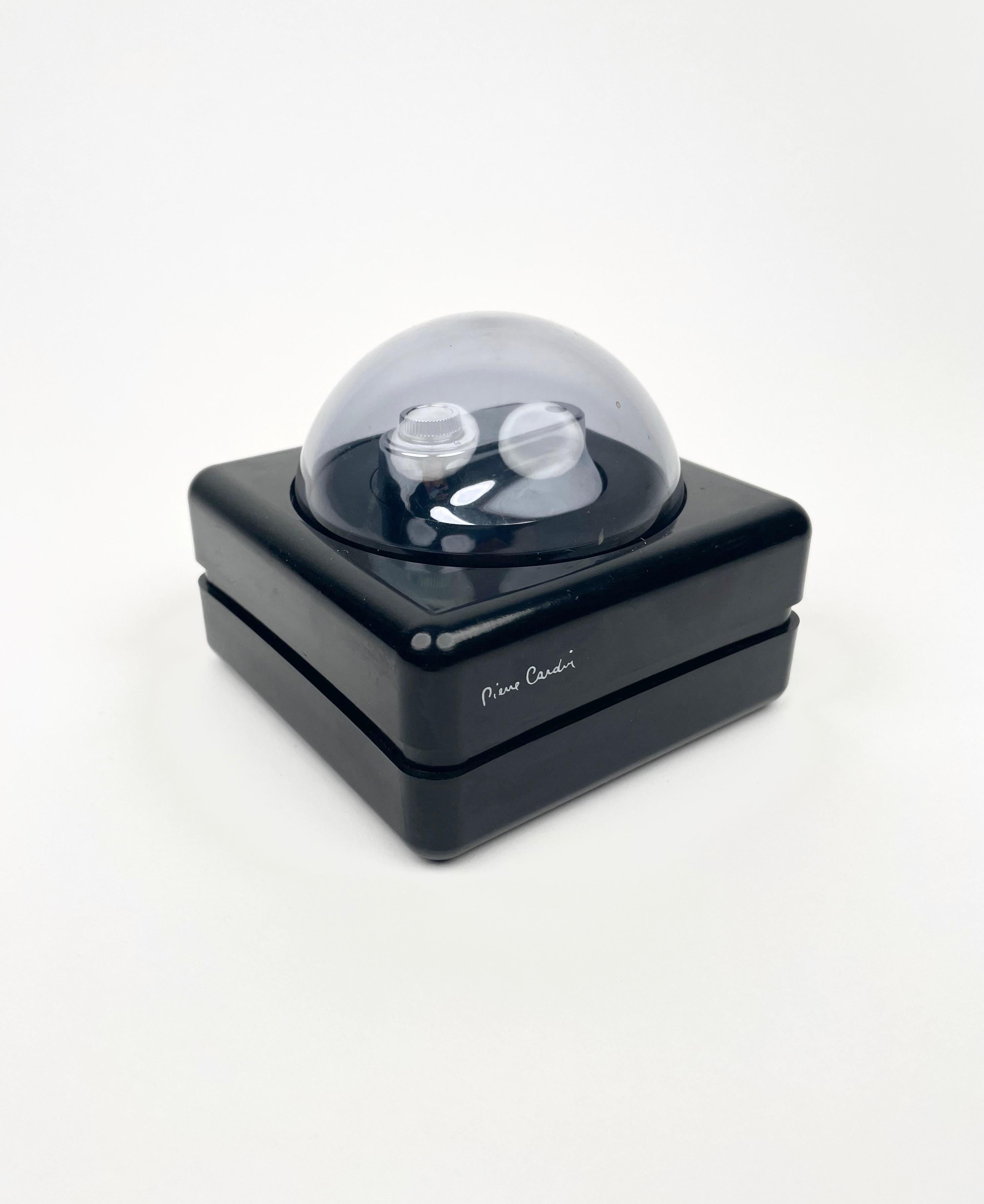 Black table lighter with smoked plexiglass dome featuring wonderful round lines, typical of the space age. This piece was designed and signed by Pierre Cardin and produced in France during the 1970s. 

The lighter system was not tested for