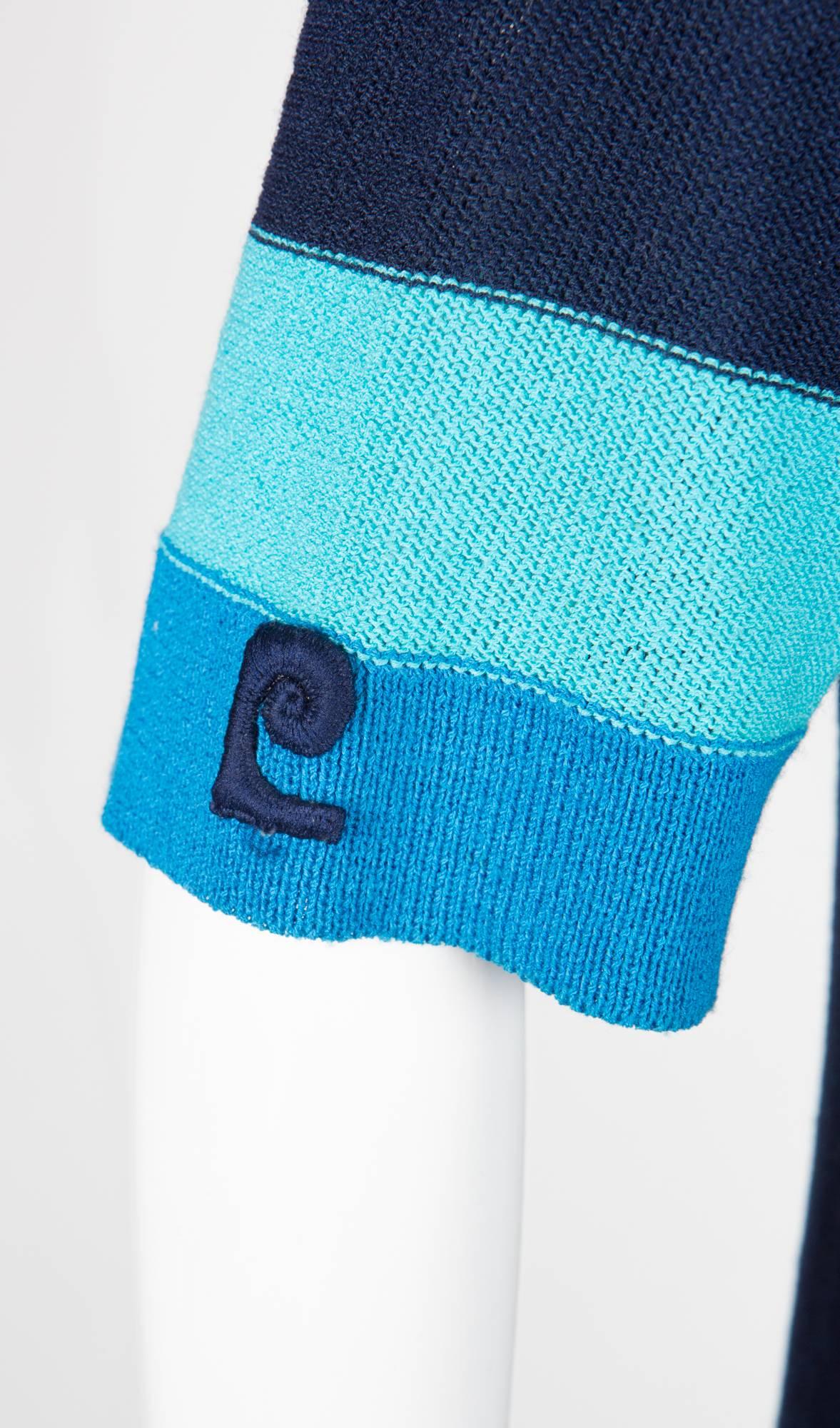 Navy Pierre Cardin crepe knitted dress featuring a reverse jersey knitting,  blue and turquoise band, an A line, a sleeve famous logo.
In good vintage condition. Made in France.
Estimated size 40fr/42fr // US8/10 // UK1/12/14
We guarantee you will