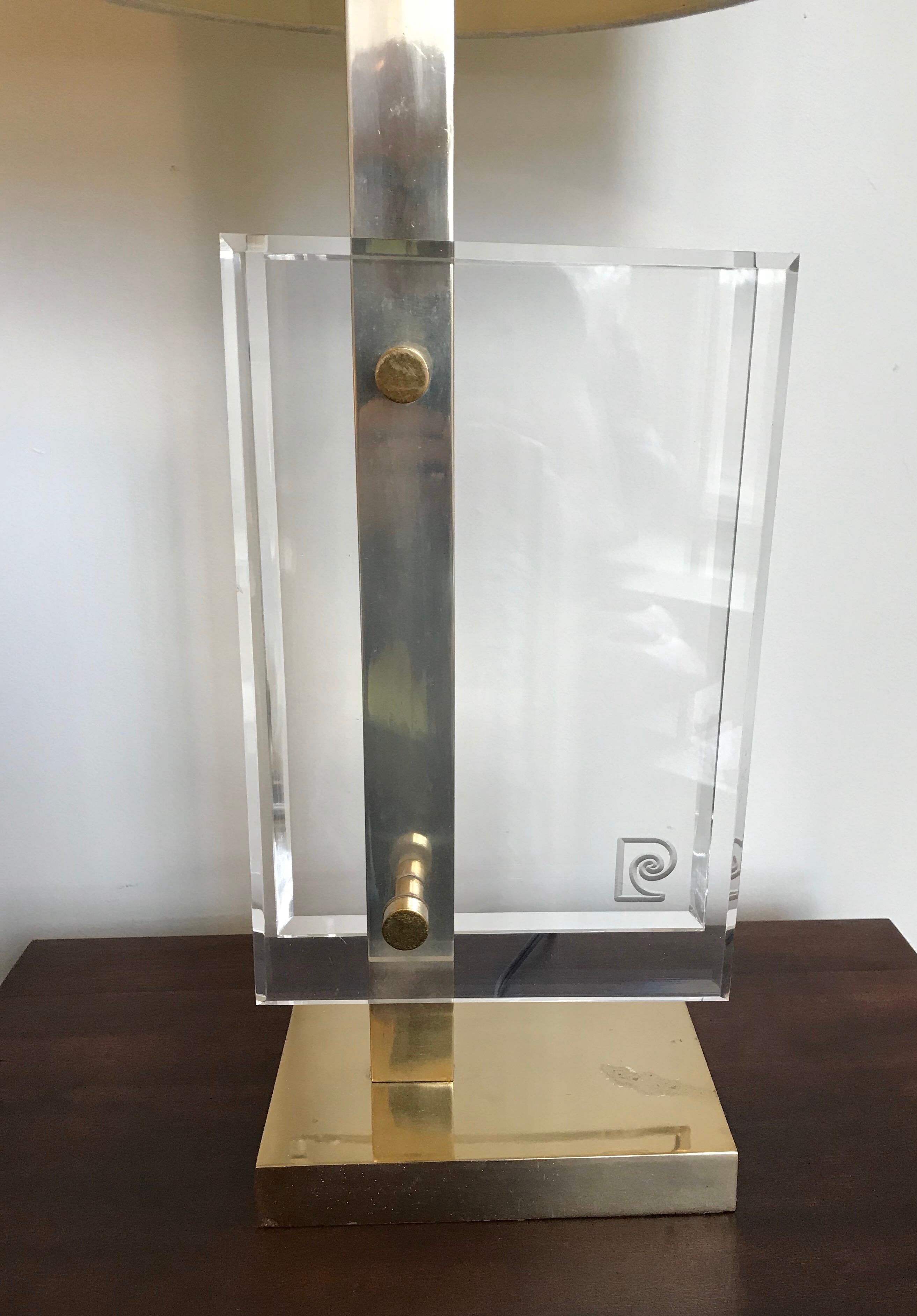 Very chic polished brass and Lucite table lamp designed by Pierre Cardin for Laurel Lamp Co.
Rewired, shade not included.