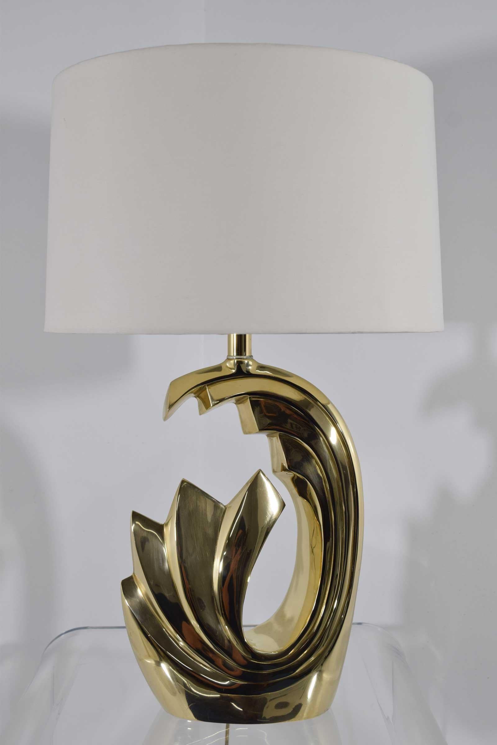 Pair of polished brass lamps designed by Pierre Cardin with a stylized tidal wave form. Rewired for use in the USA. Shades not included. Stamped C-86 at base. Measurement of 26