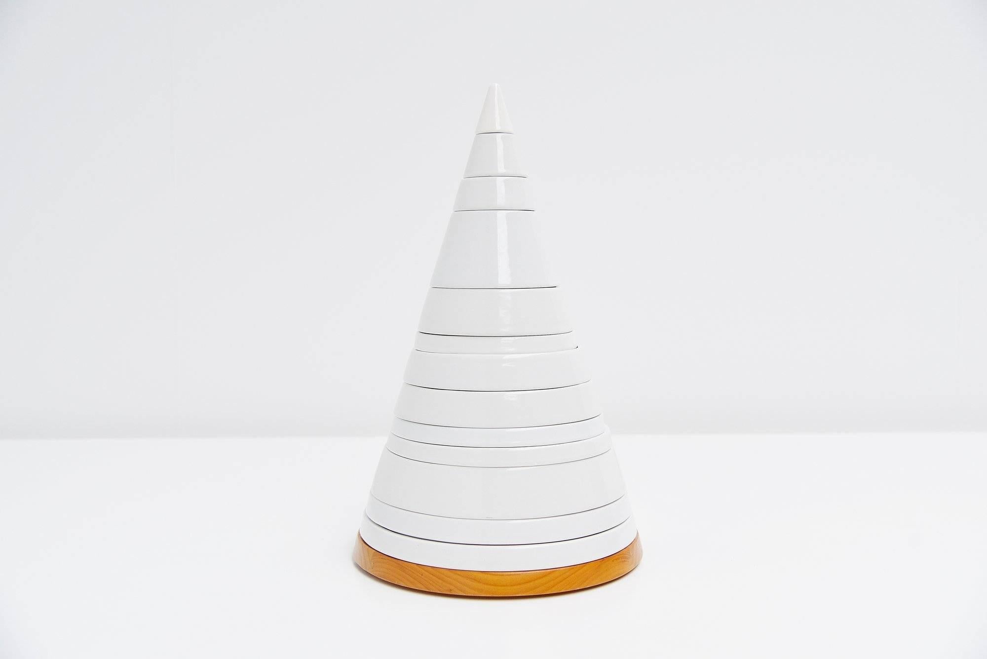 Very nice sculptural ceramic tableware set designed by Pierre Cardin for Ceramica Franco Pozzi, Italy, 1970. This very nice tableware tower is made of white glazed ceramic and what’s unique to this piece is that the wooden bread cutting board is