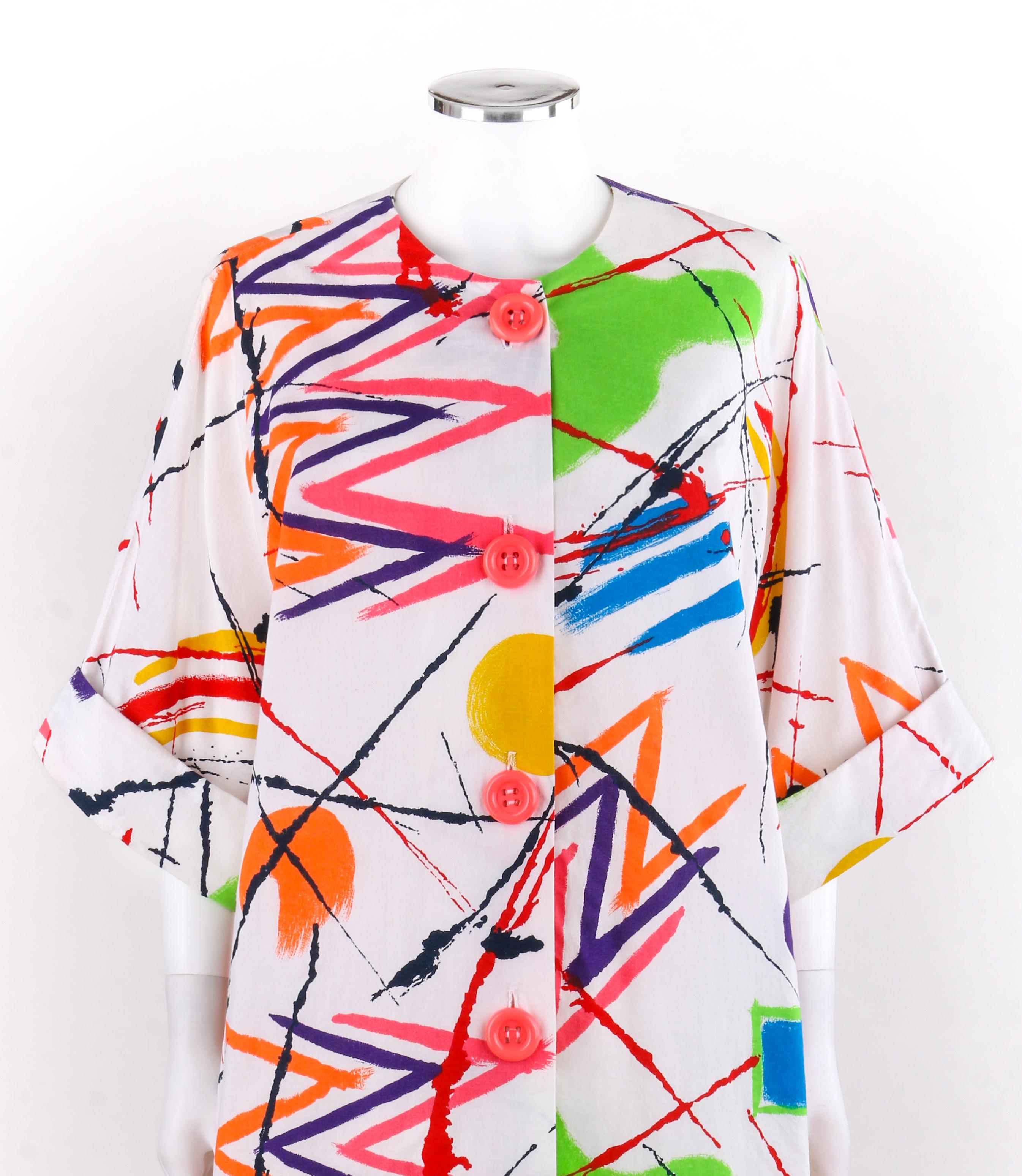PIERRE CARDIN c.1980’s Multi-color Abstract Painterly Button Up Tunic Smock Dress 
 
Circa: 1980’s - 1990's
Label(s): Pierre Cardin 
Style: Tunic, smock, dress
Color(s): Shades of white, pink, orange, yellow, green, blue, purple and red. 
Lined:
