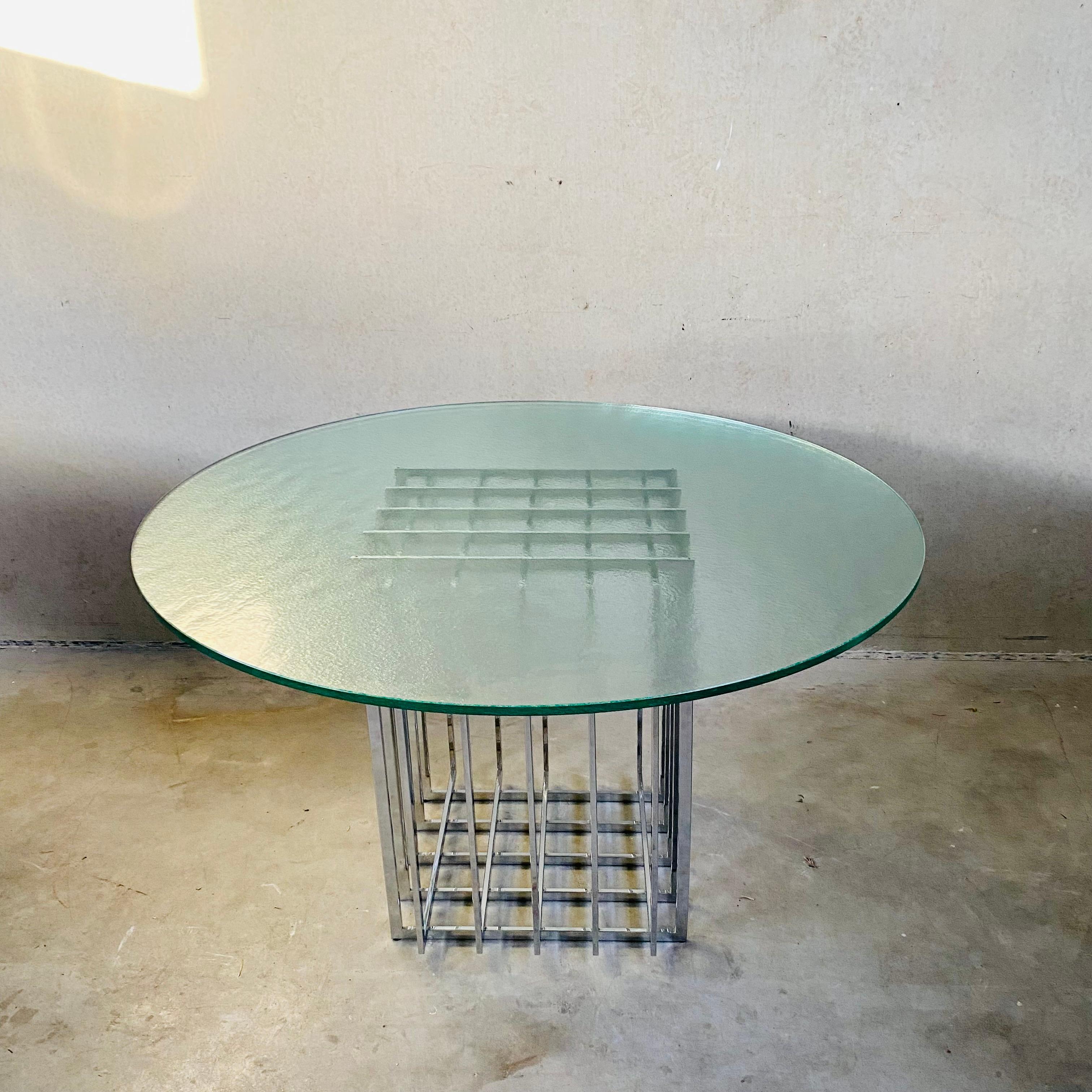 Introducing the stunning Round dining table with grid-like chromed metal base and brute glass top by Pierre Cardin model 