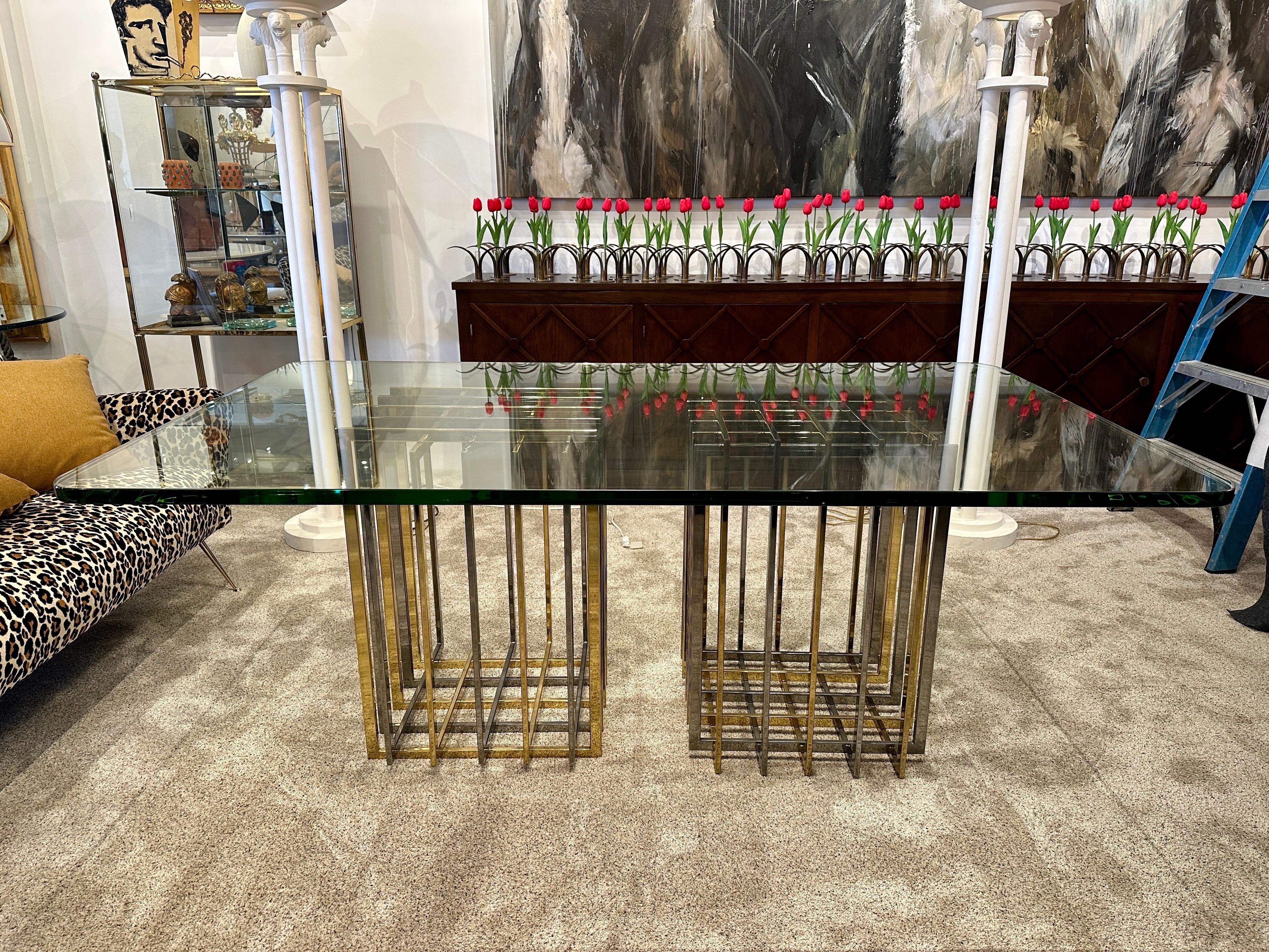 This table is comprised of TWO Pierre Cardin cage style bases in nickel and brass interlocking flat bars (can be used as square shown here or in diamond shapes). The 1 inch thick glass top is also a wonderful Italian green tone edge glass which is