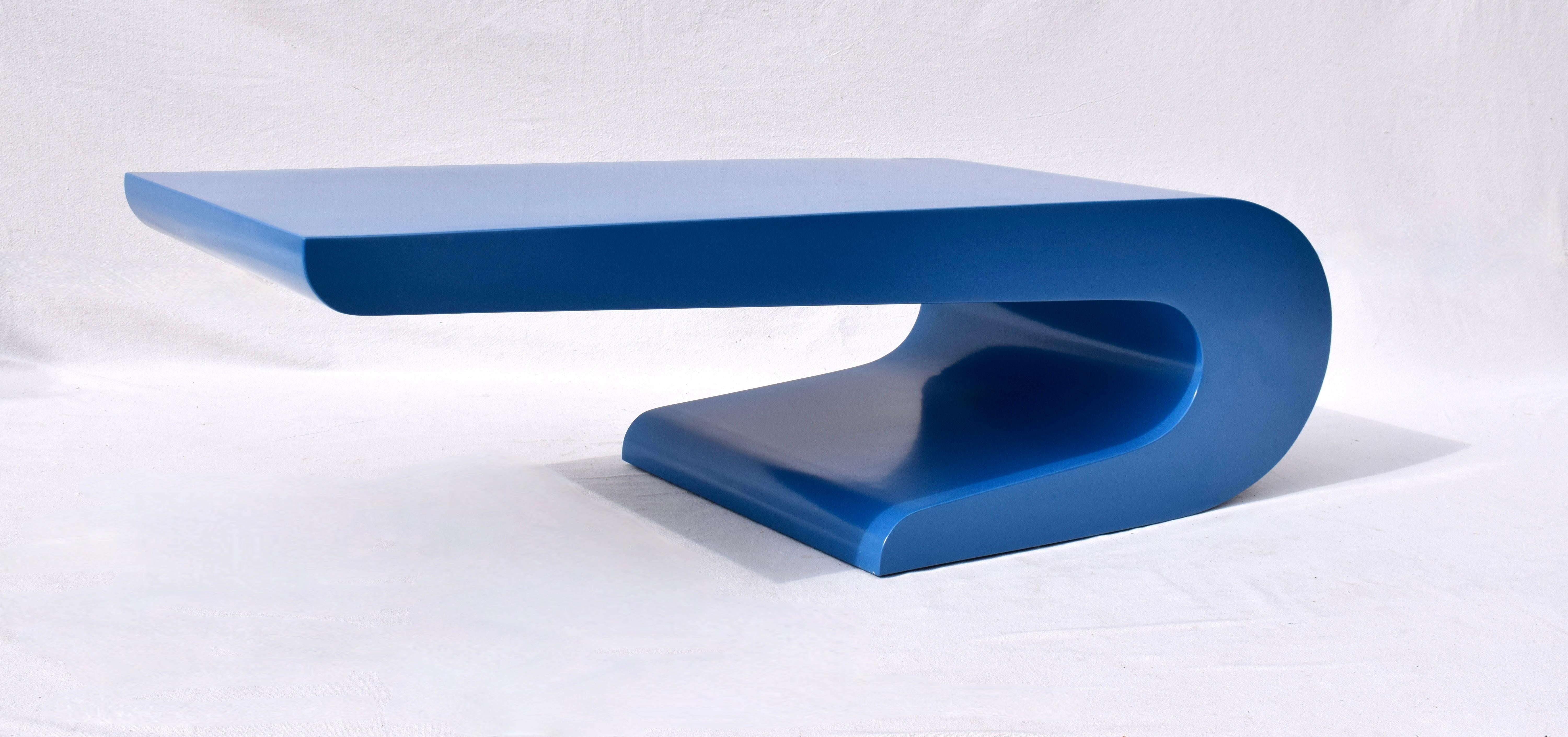 Cantilevered coffee or cocktail table rendered in wood with new Cerulean blue lacquered finish by Pierre Cardin. Simply exquisite.