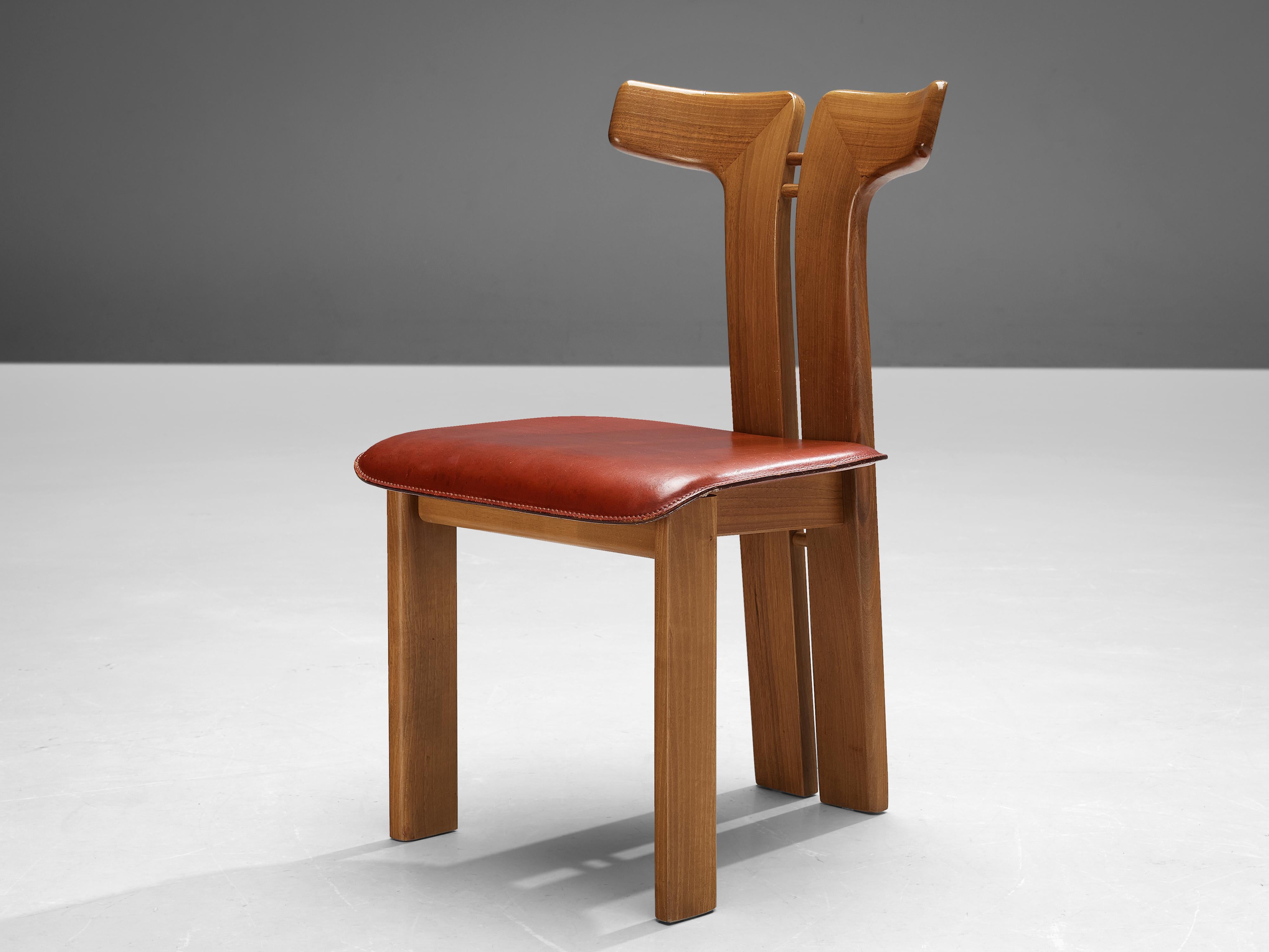 Pierre Cardin, dining chair, walnut, cognac leather, Italy, 1980s 

This sculptural chair is designed by Italian designer Pierre Cardin (1922-2020). The curved back highlights the qualities of the wood and its shape in an unparalleled manner.