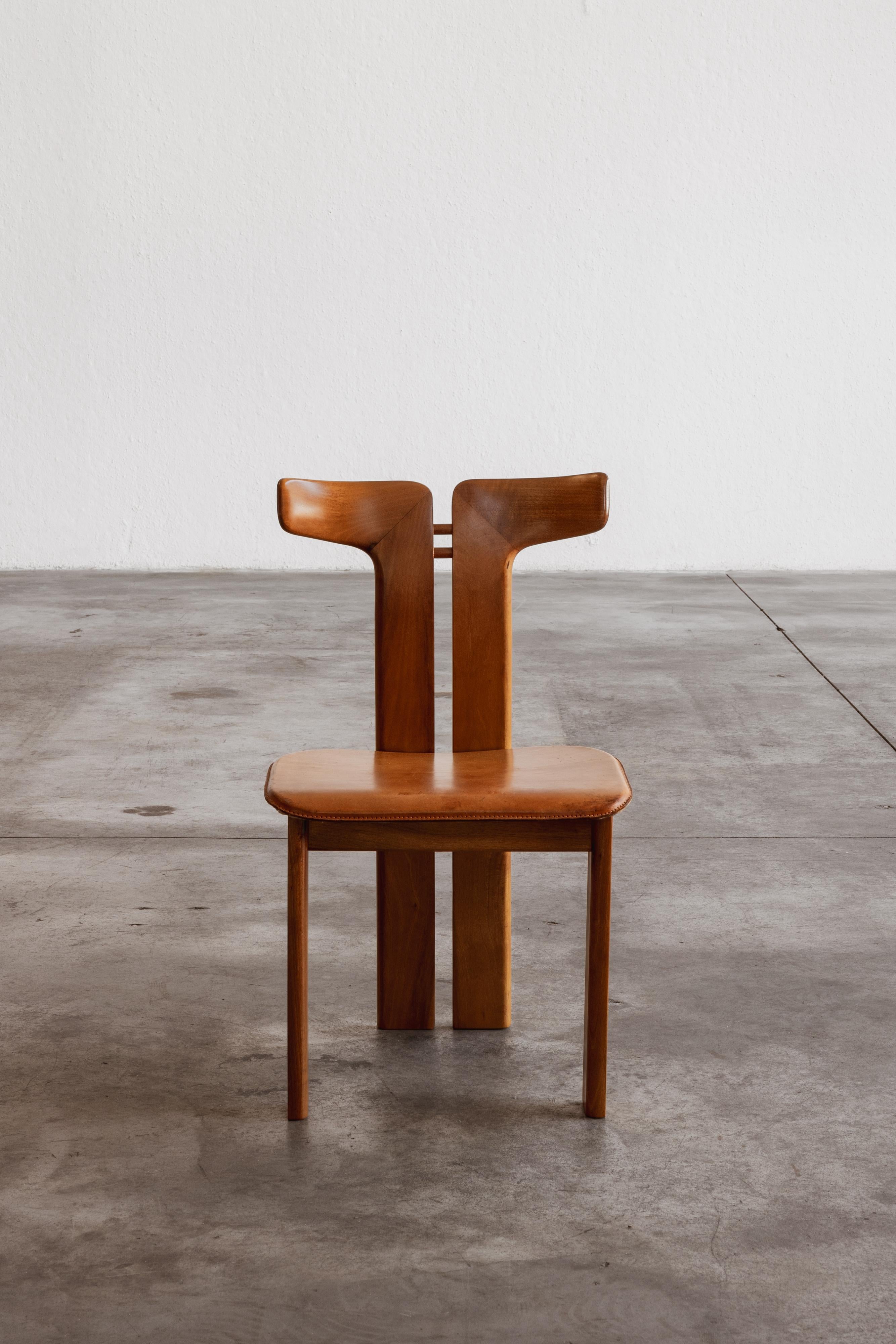 Pierre Cardin dining chair for Roche Bobois, wood and patinated cognac leather, France, 1970.

Pierre Cardin designed these iconic dining chairs for Roche Bobois in 1970. The essence of the design lies in the sculptural backrest. Freely inspired by
