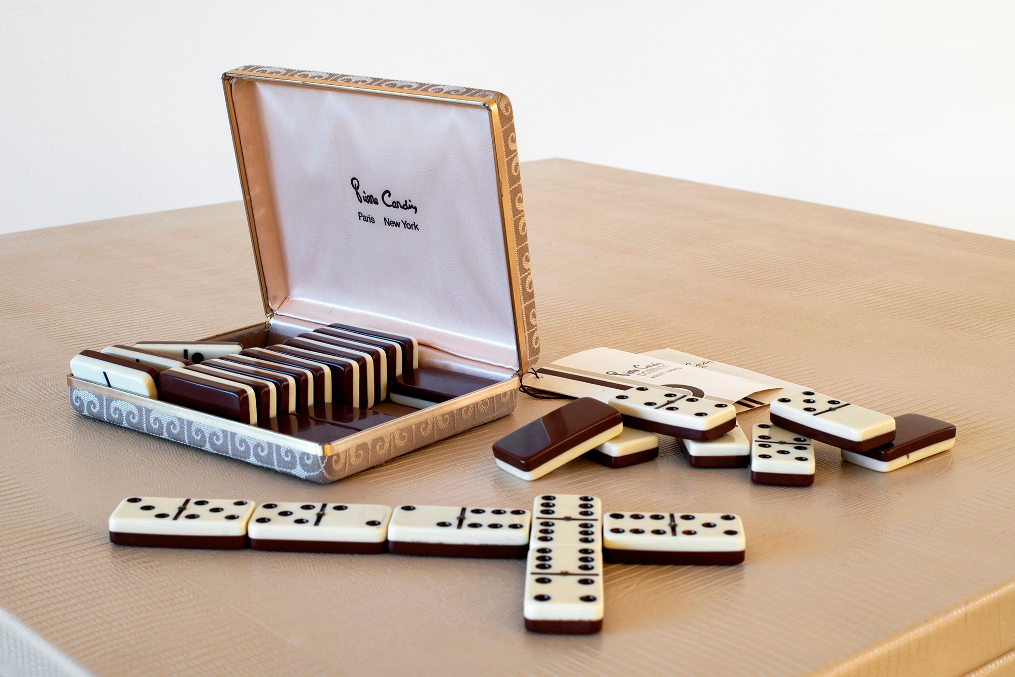 Pierre Cardin domino set with original brocade fabric case.

Pristin original condition with 30 original pieces.