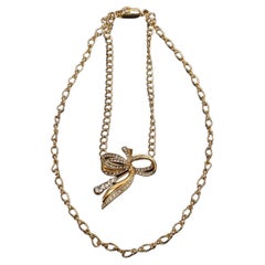 Pierre Cardin double-strand choker necklace, gold chain and rhinestone bow