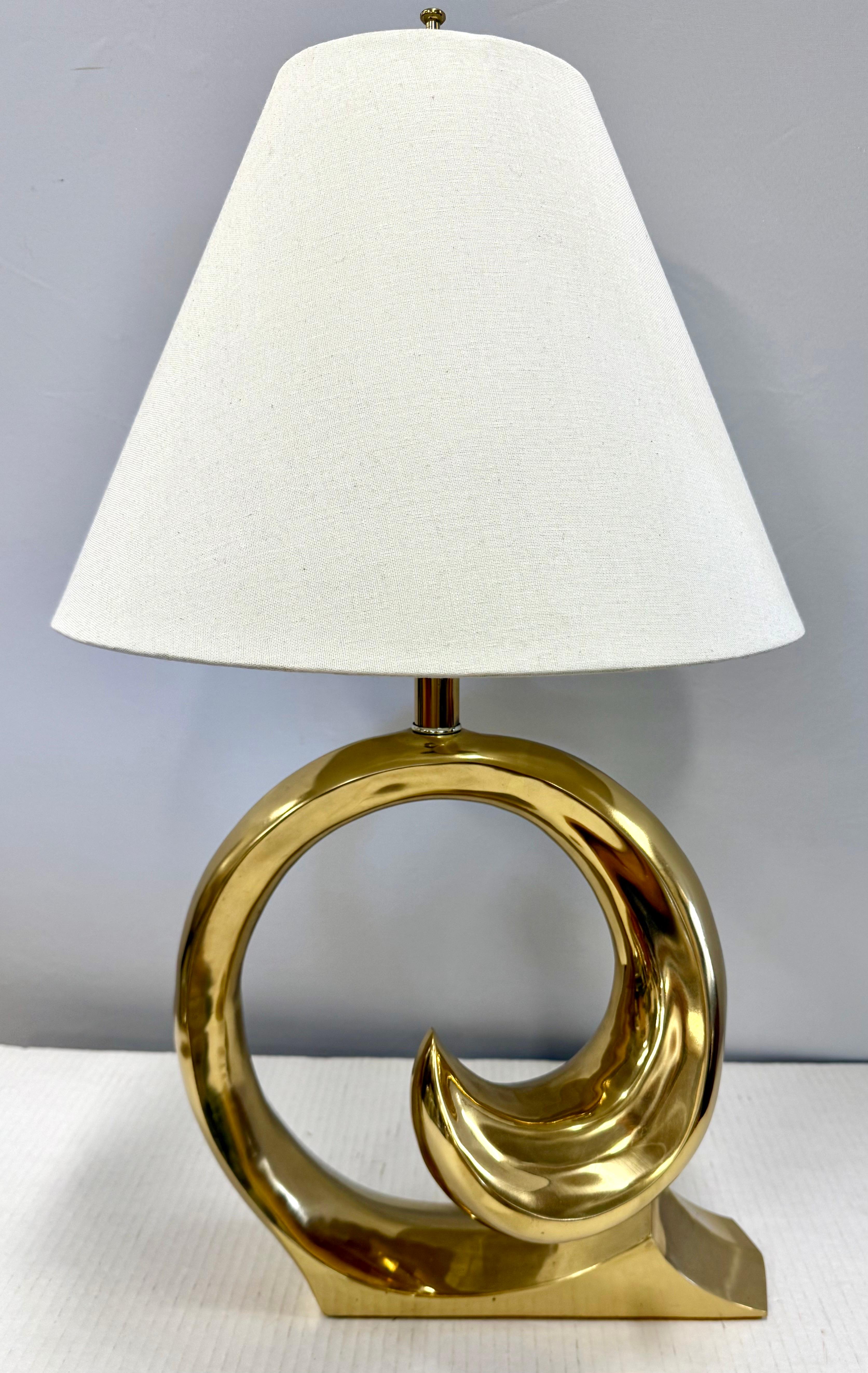 Pierre Cardin for Erwin-Lambeth table lamp that showcases a bold sculptural brass swirl base with the emblematic Cardin design that radiates glamour and sophistication.  Shade not included.